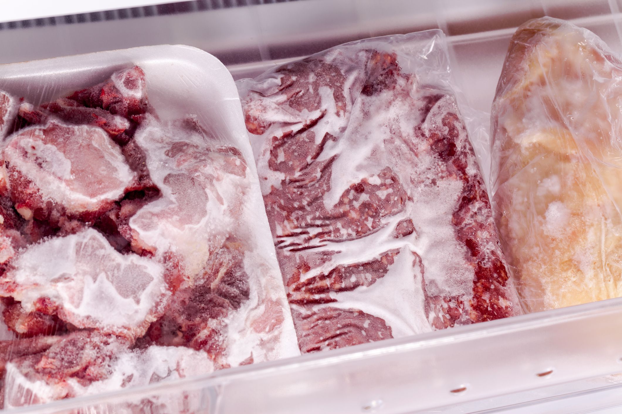 Four drawer freezer, full meet and chicken in studio shot