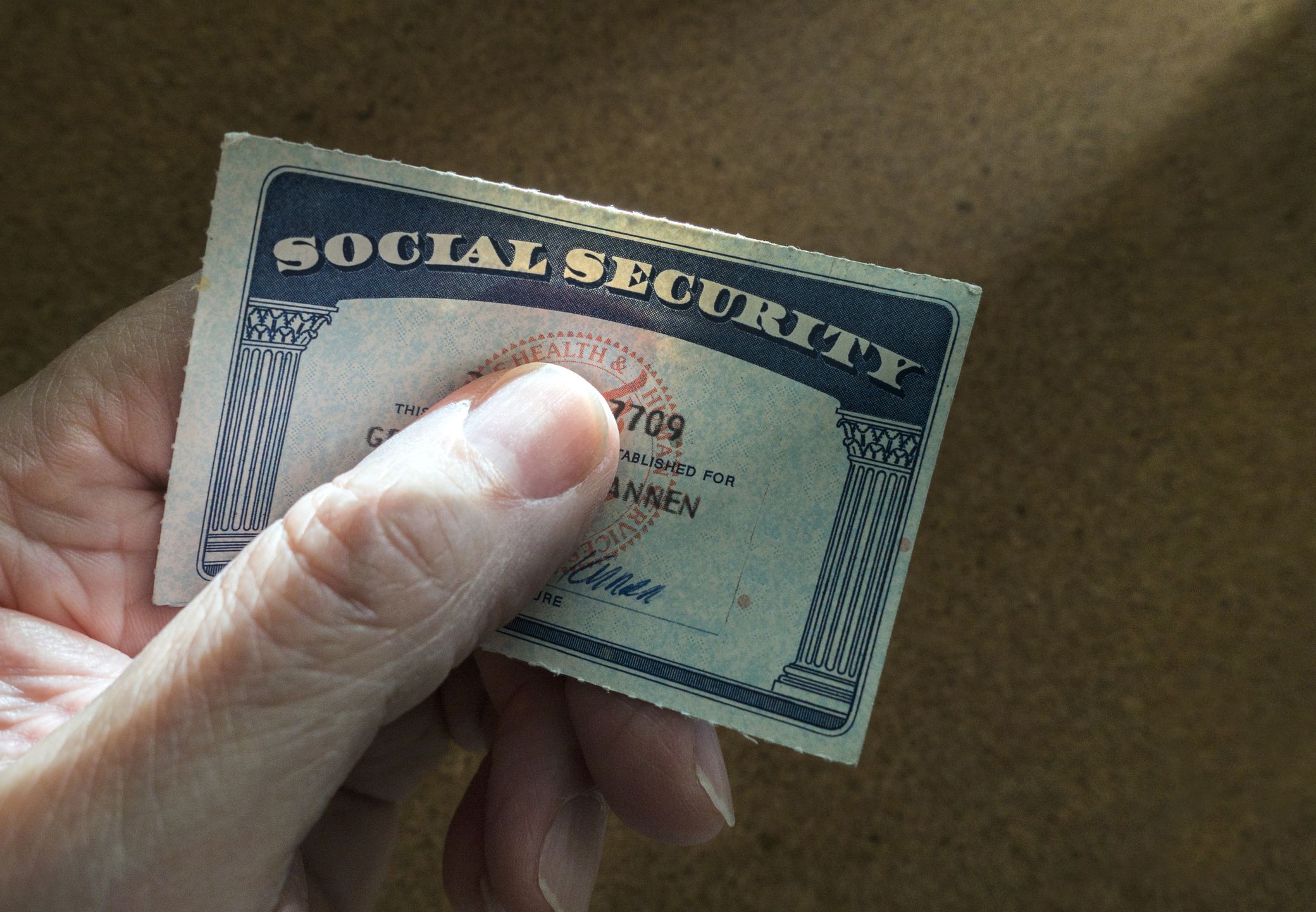 hand holding social security card