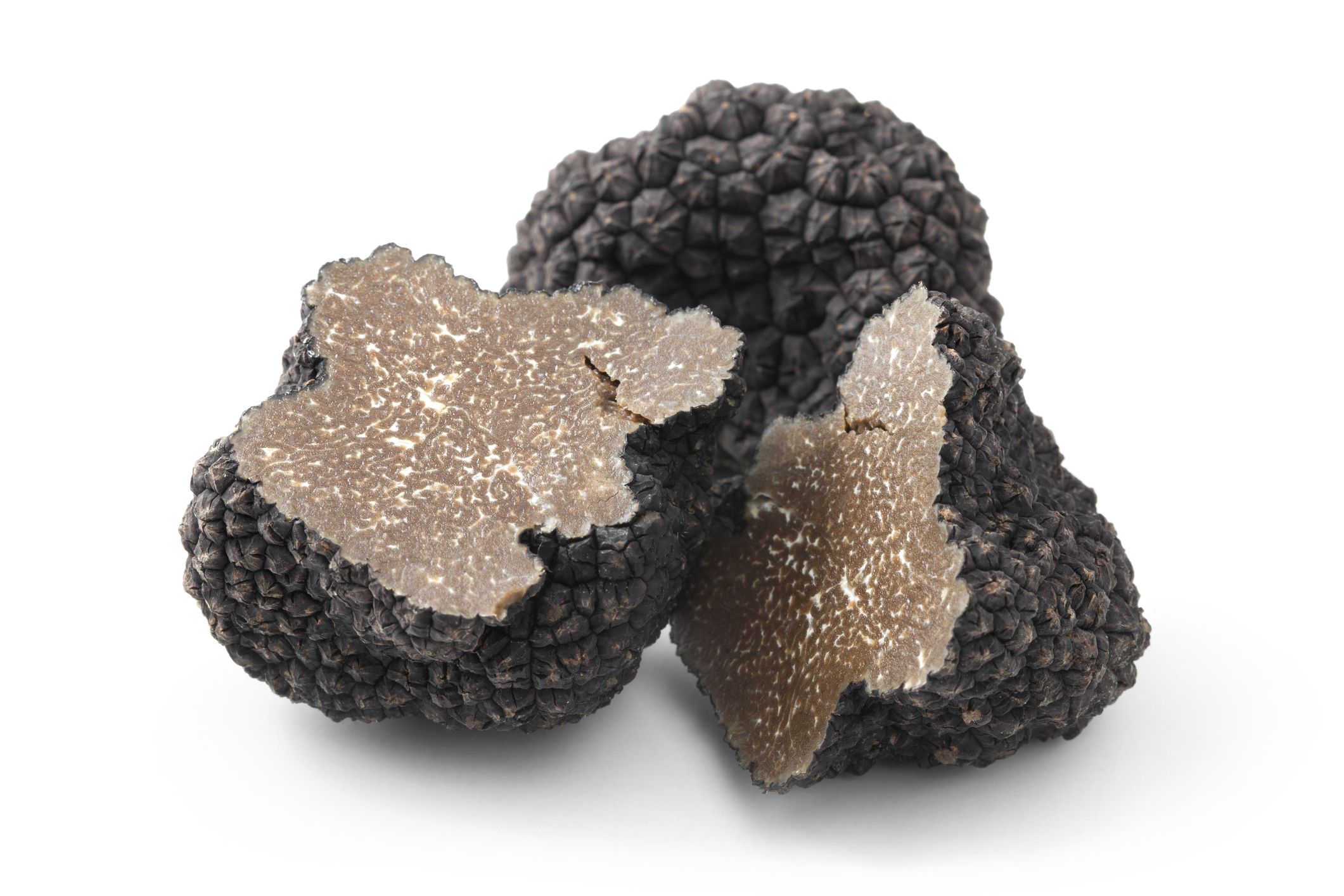 Black truffles on a white background.
