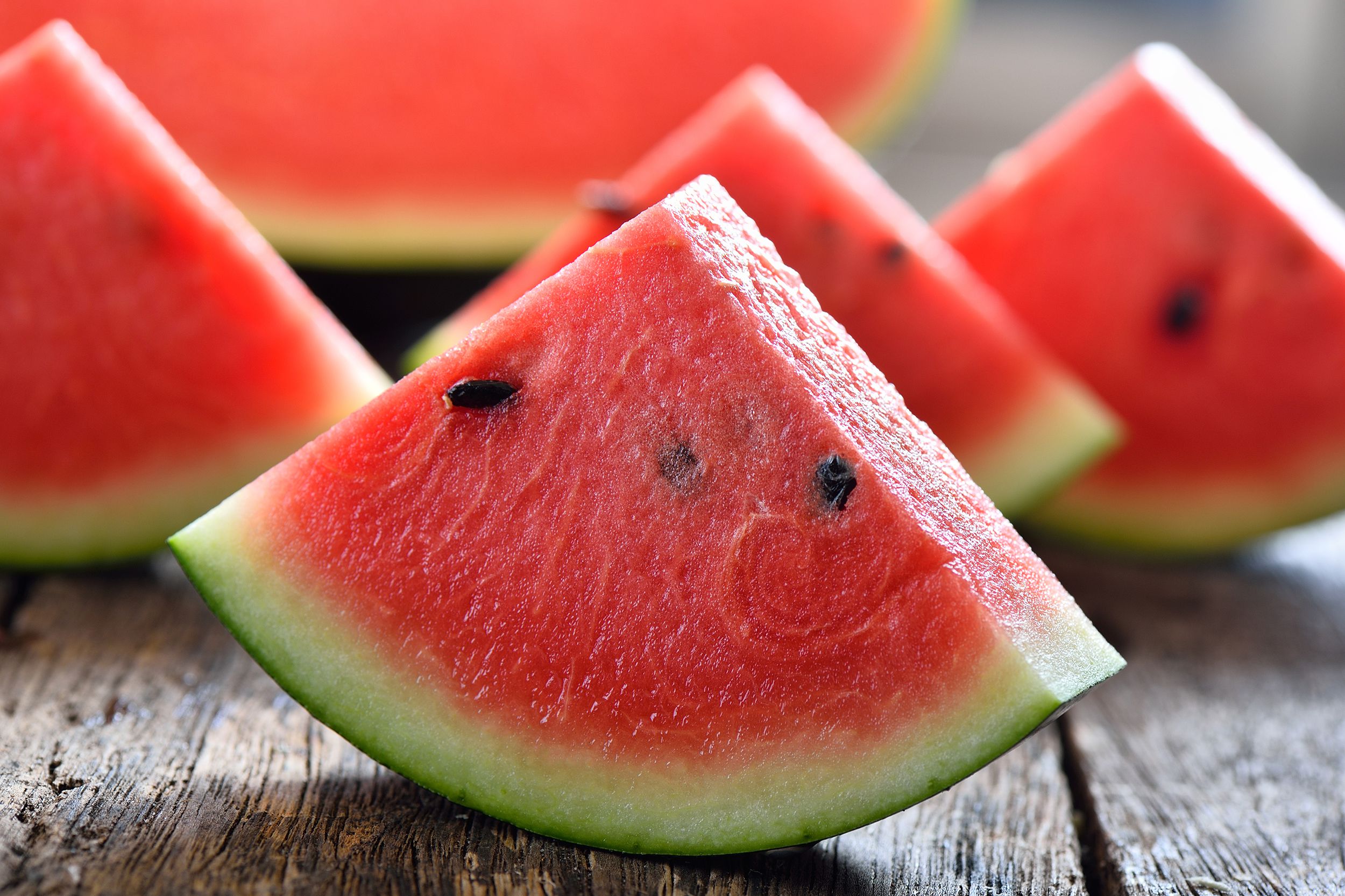 watermelon sliced on wooden background