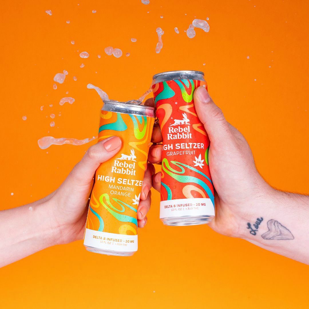 two cans cheers with rebel rabbit seltzer
