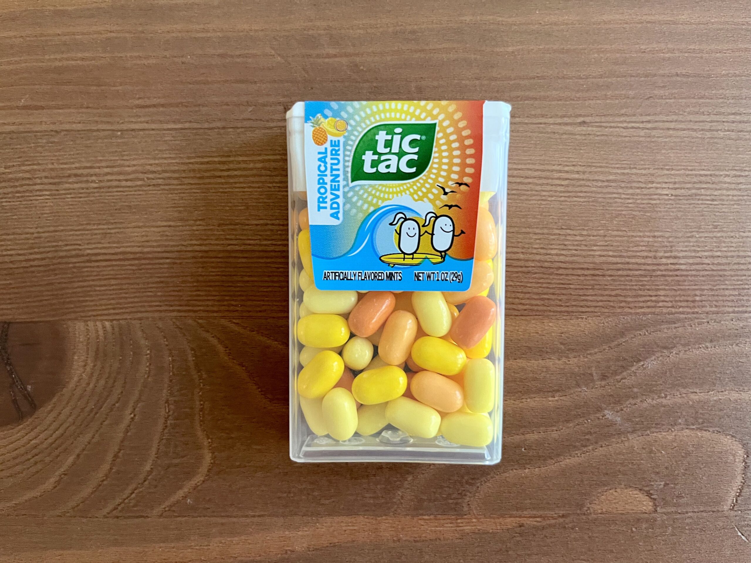 a box of tropical adventure tic tacs sitting on a table