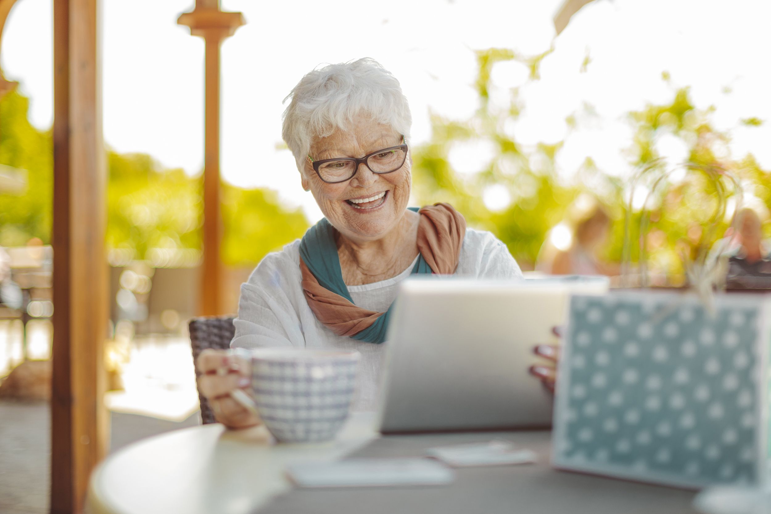 beautiful senior woman looking at laptop