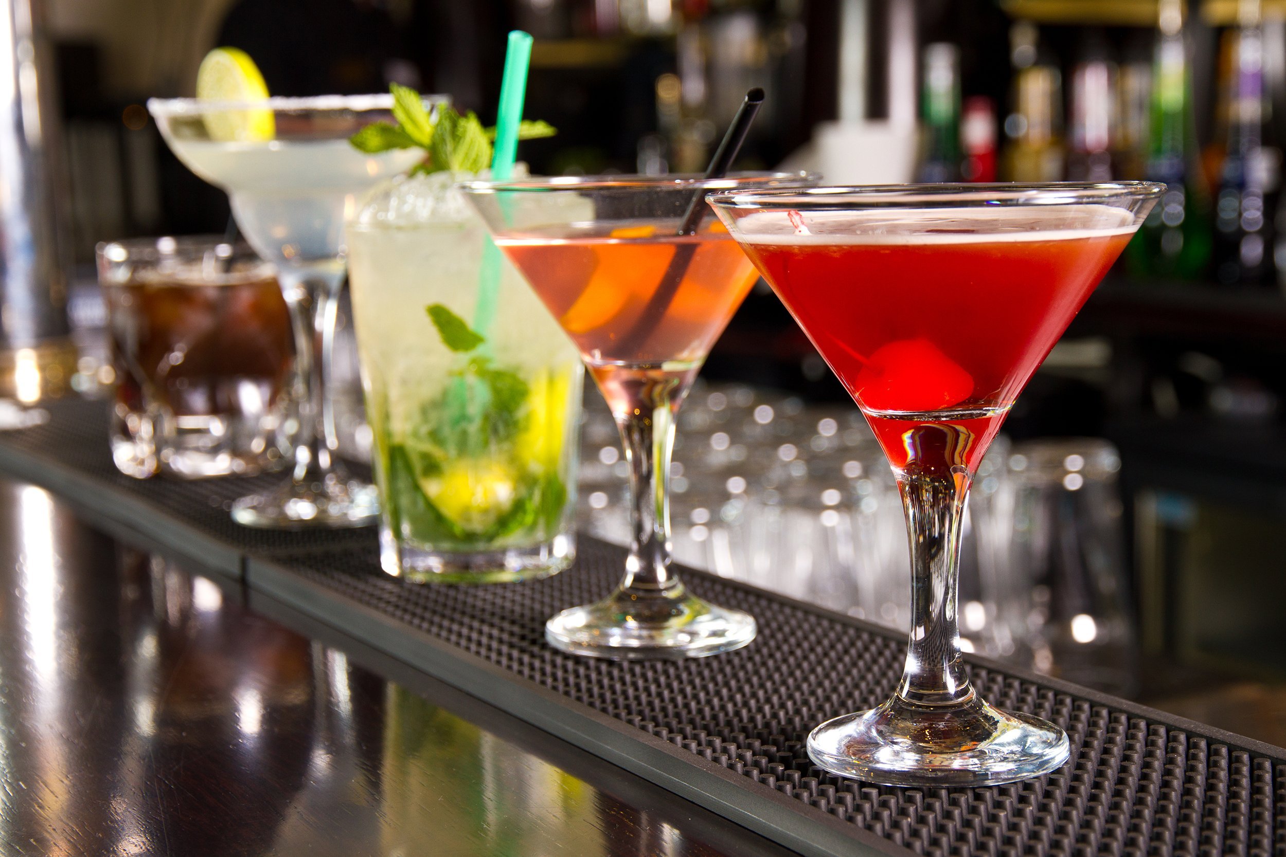 five cocktails on the bar counter