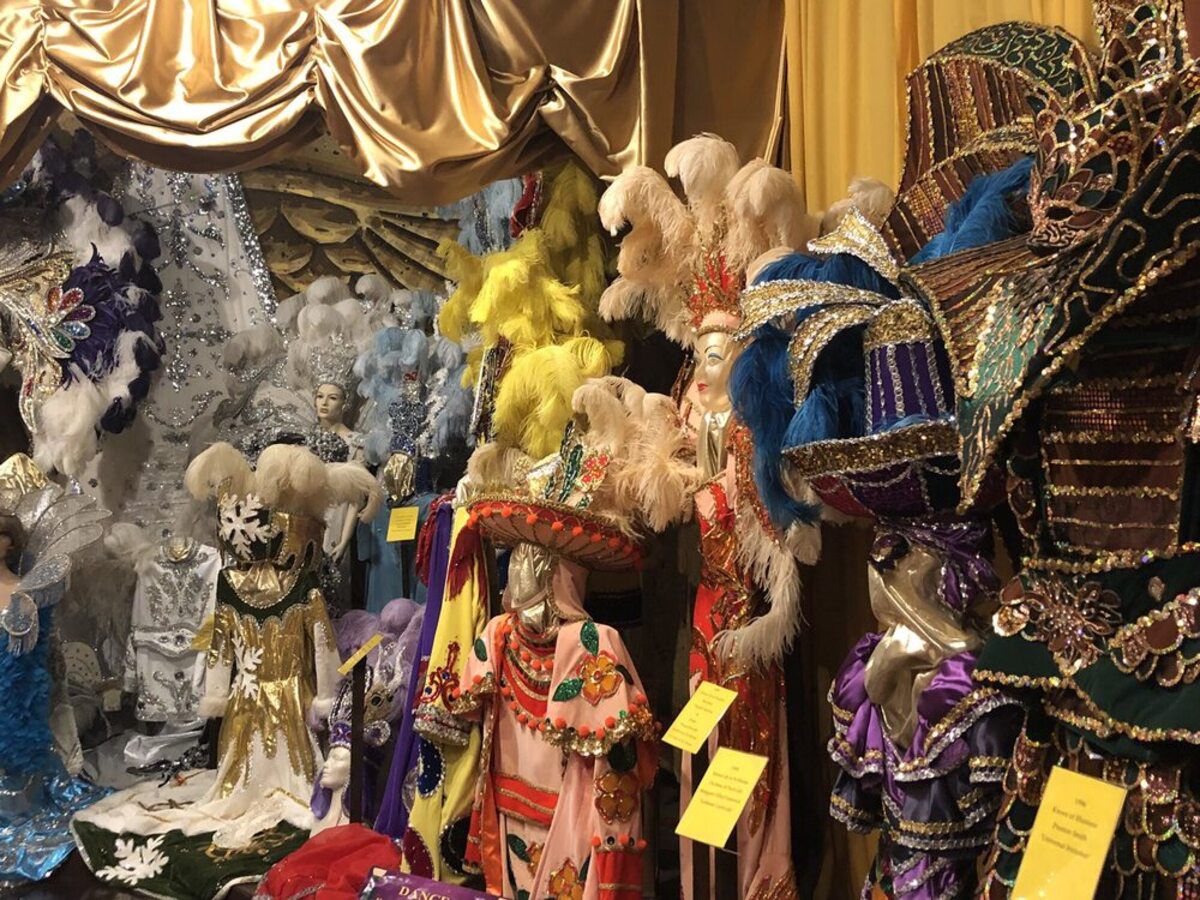 Several colorful and extravagant costumes for display in Mardi Gras Museum, Lake Charles, Louisiana, for dolls and children