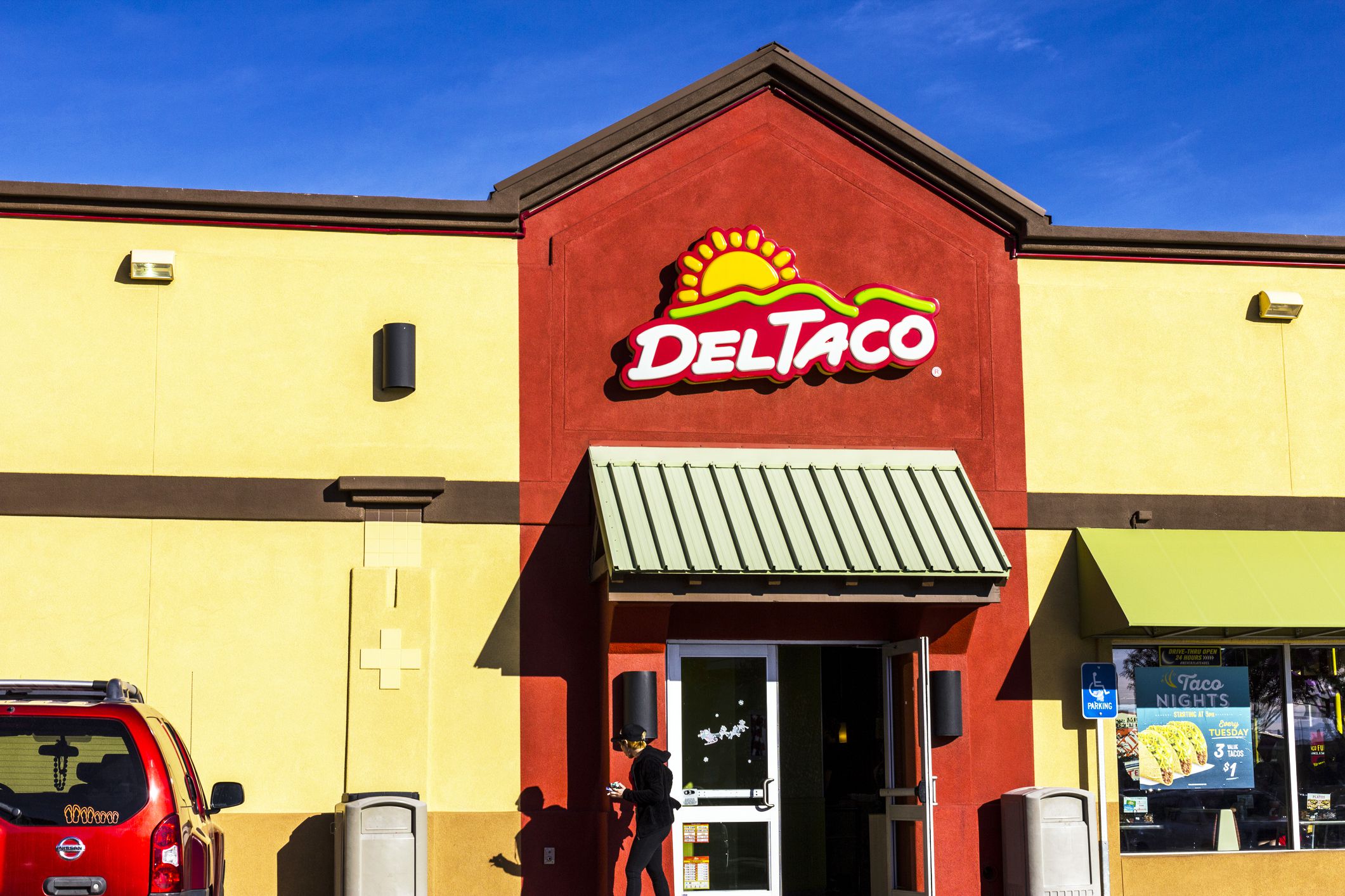 Person walking out of Del Taco