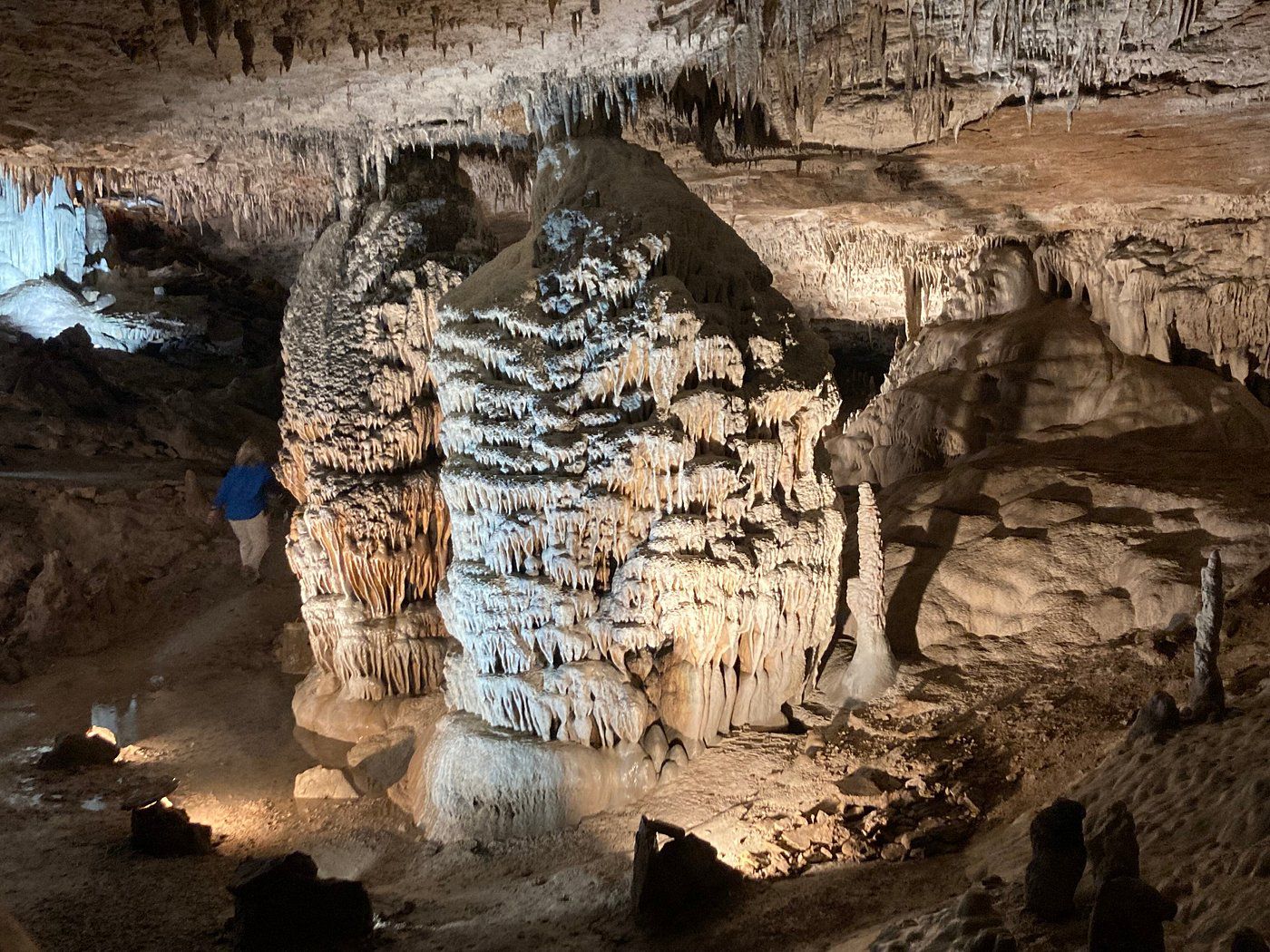 Beige stalactites and stalagmites brightly lit up in Fantastic Caverns, Springfield, Missouri