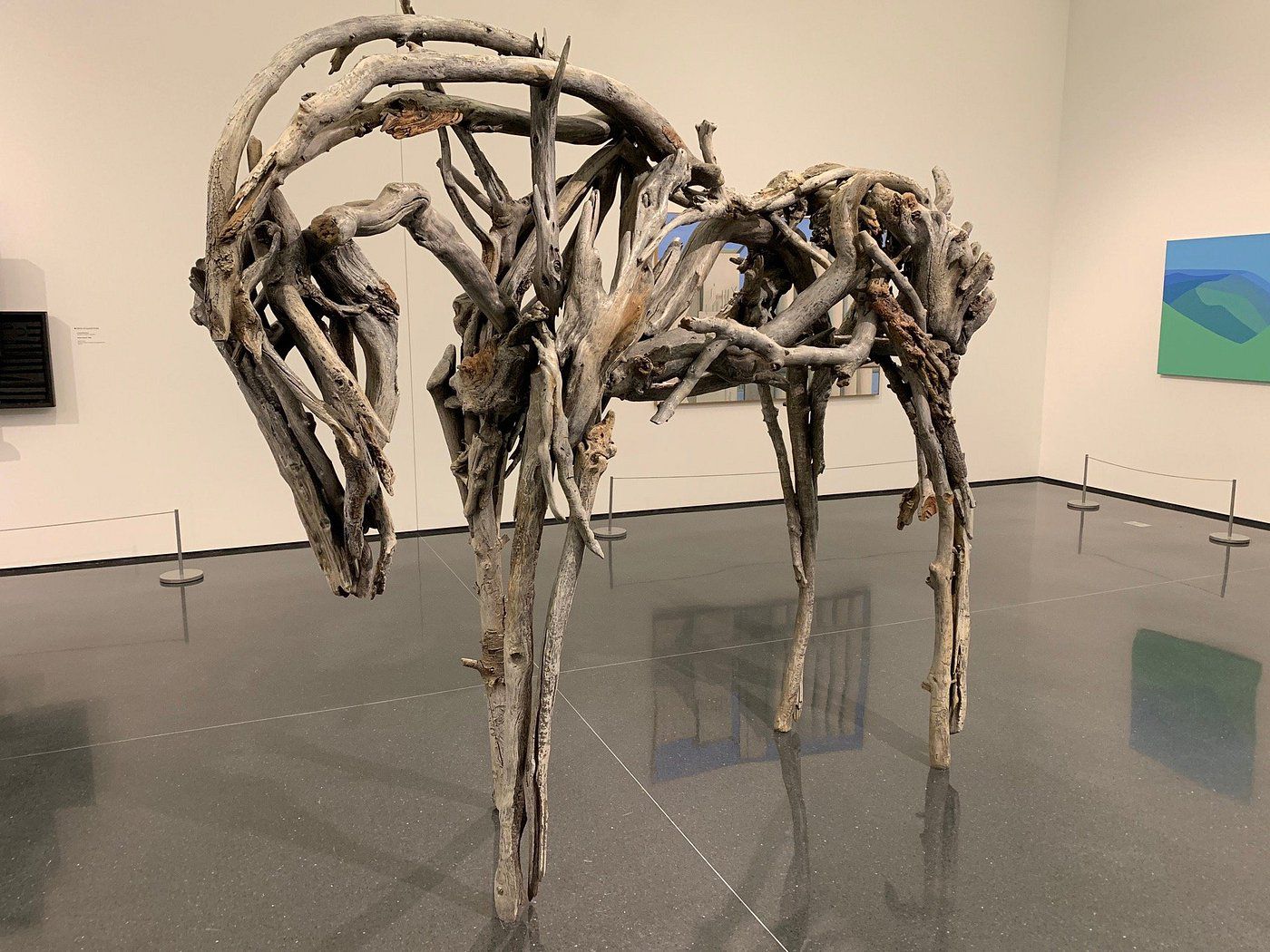 Horse artwork made of wooden branches in Figge Art Museum, Davenport, Iowa, grey floor and white walls