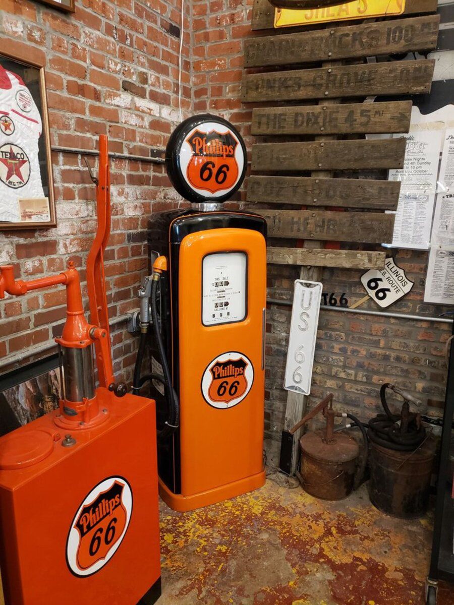 Phillips 66 gas pump exhibit inside Route 66 Association Hall of Fame & Museum, Pontiac, Illinois, in corner of room with brick wall