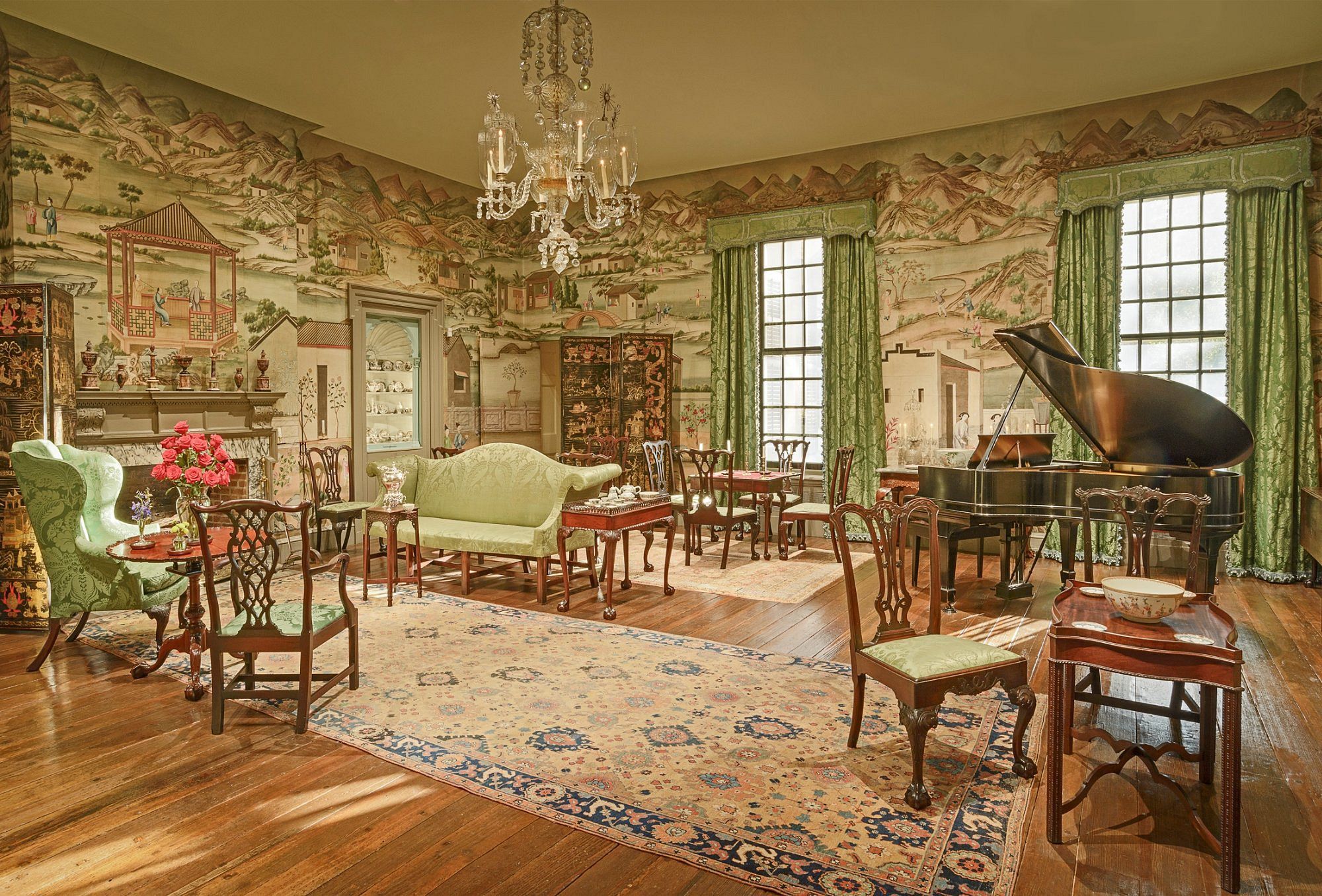Interior room in Winterthur, New Castle County, Delaware, painting on wall, light greens and wood, hardwood floors, sunlight coming in through the windows