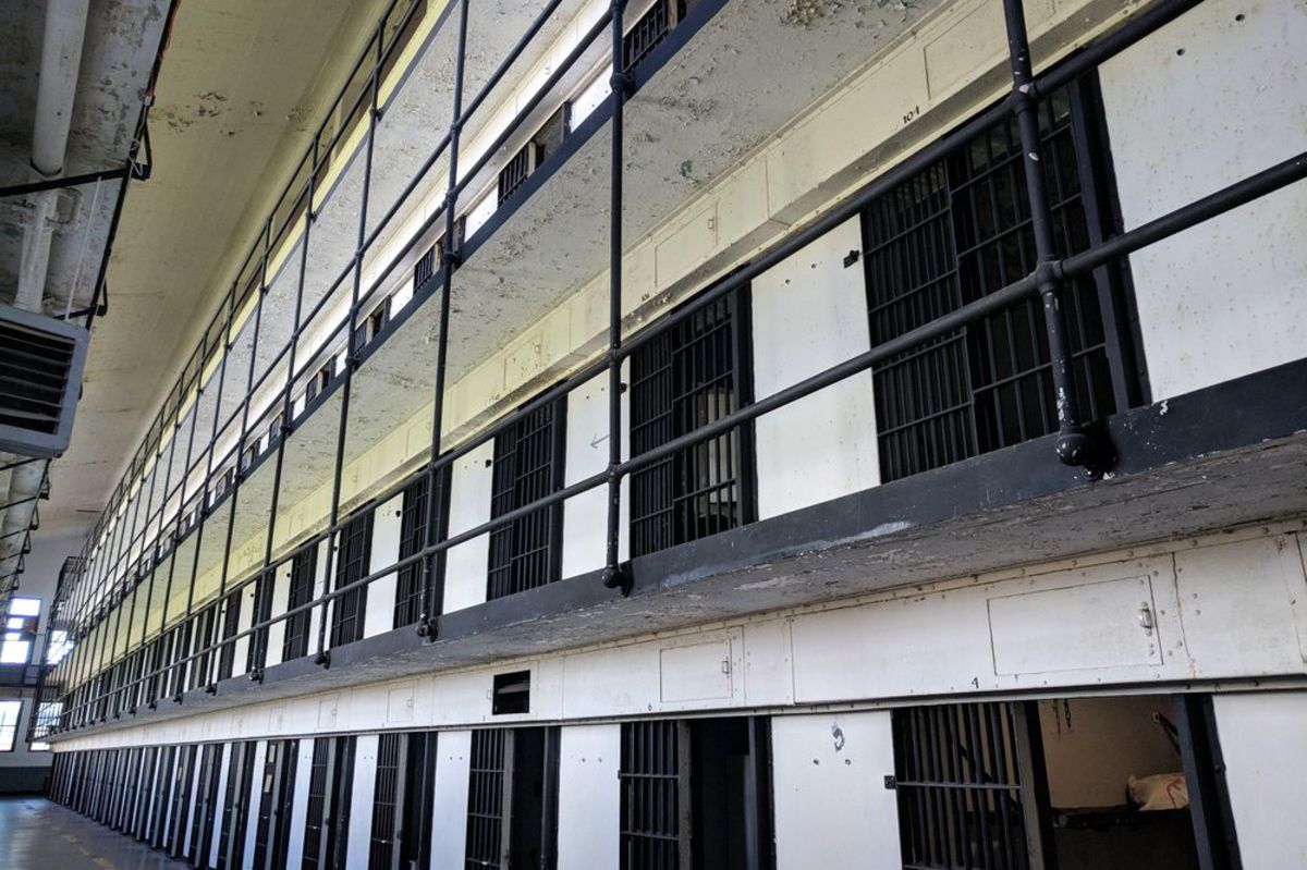 Interior of Old Prison Museum, Deer Lodge, Montana, four rows of cells, bare and semi-clean empty prison
