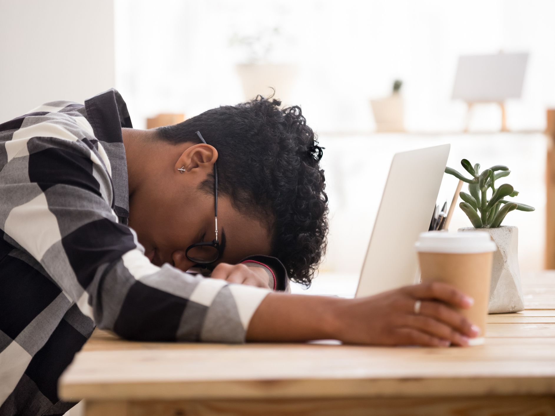 Bored exhausted african american woman falling asleep at workplace, tired overworked deprived black female student worker sleeping at work desk after insomnia, lack of sleep, office boredom concept