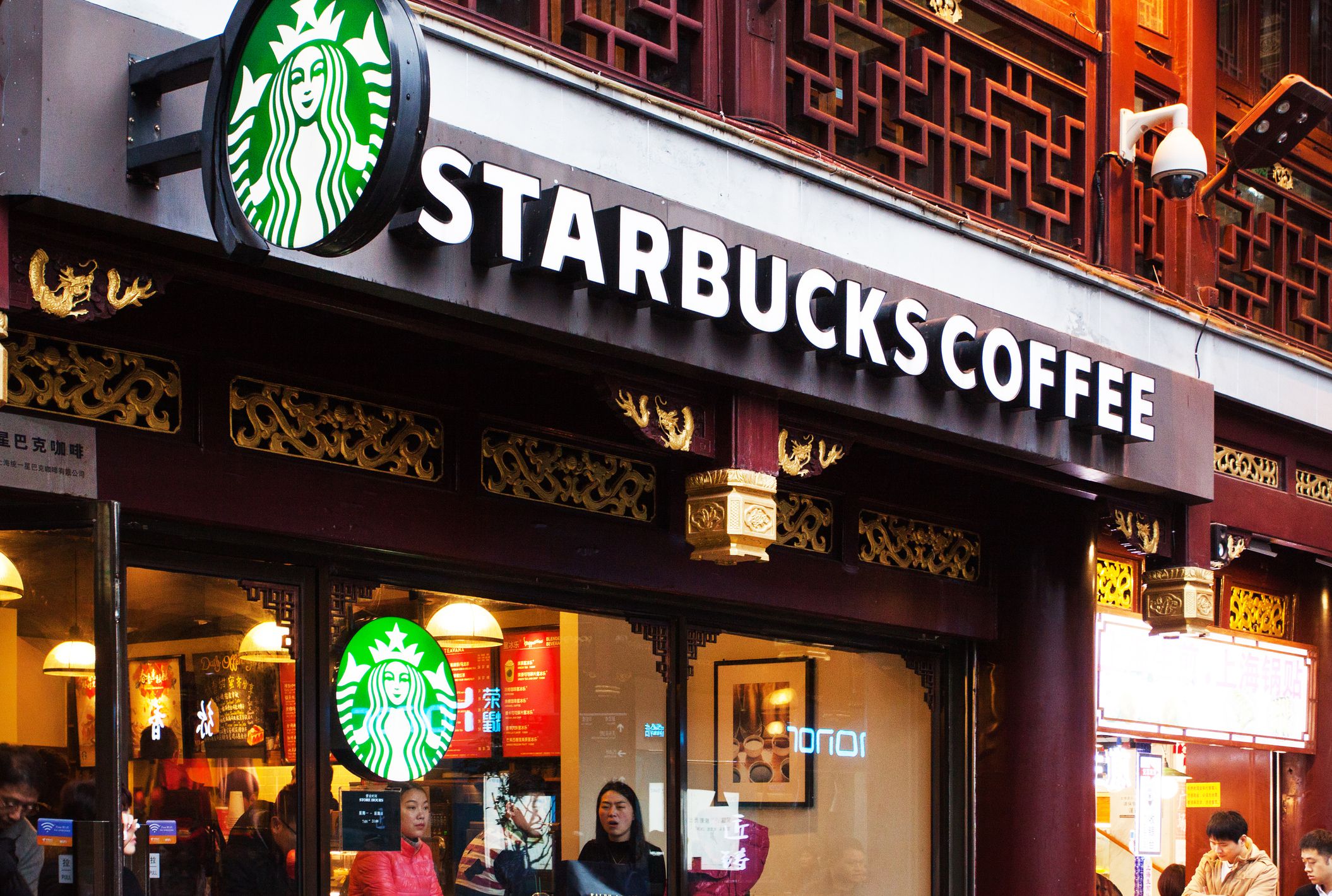 front window of busy Starbucks Coffee, Shanghai, China