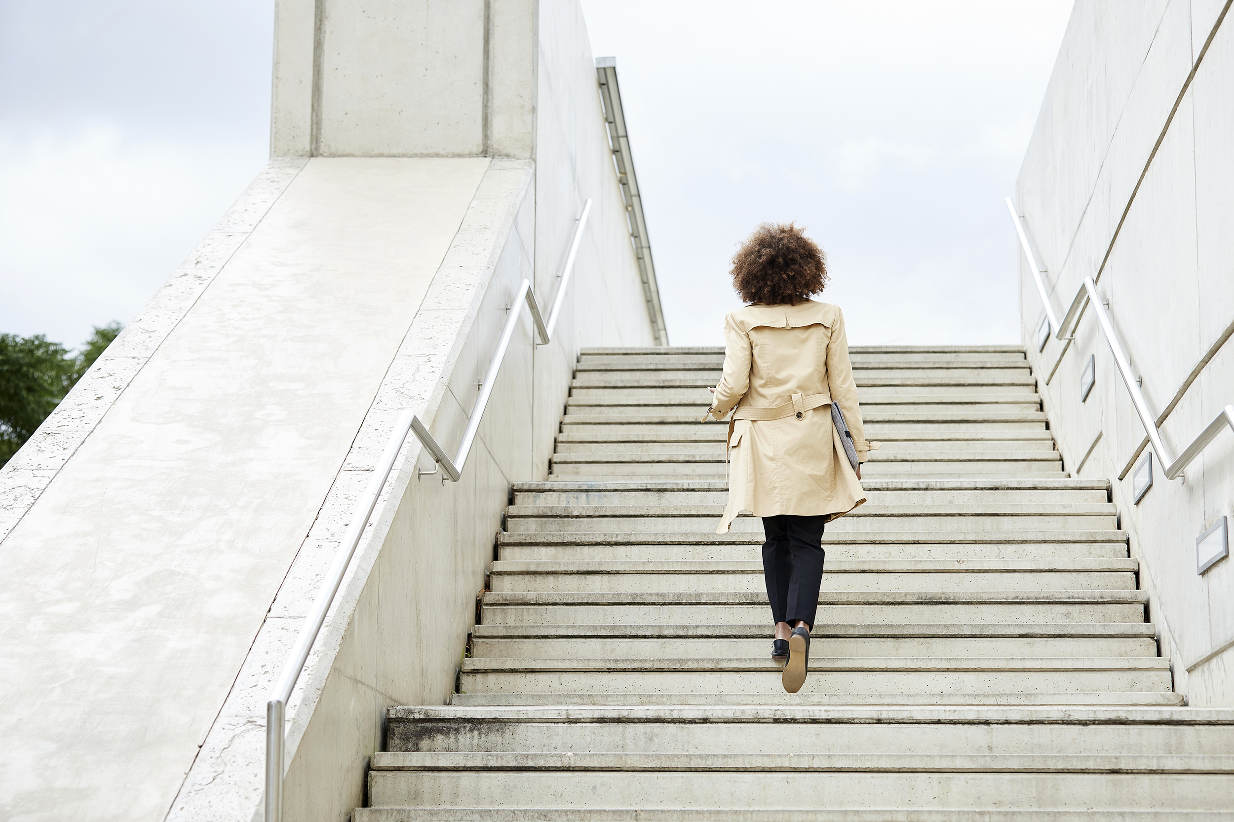 Woman walking up the stairs
