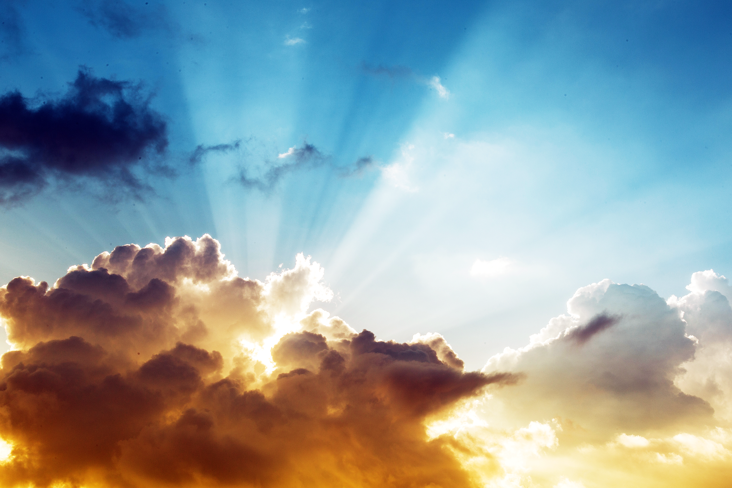 Light shining through the clouds in the sky