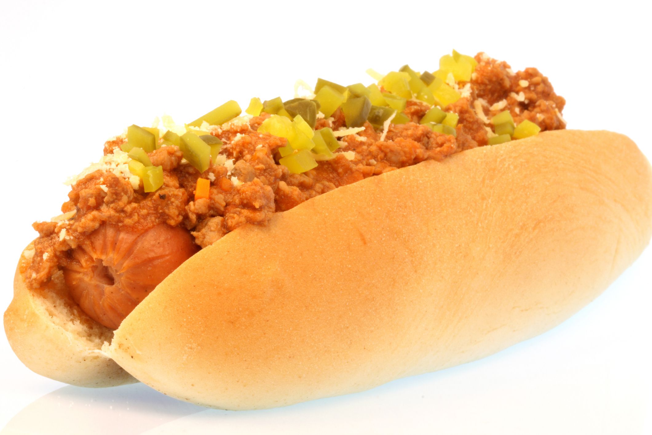 Tasty Hotdog with souce and vegetables isolated on white