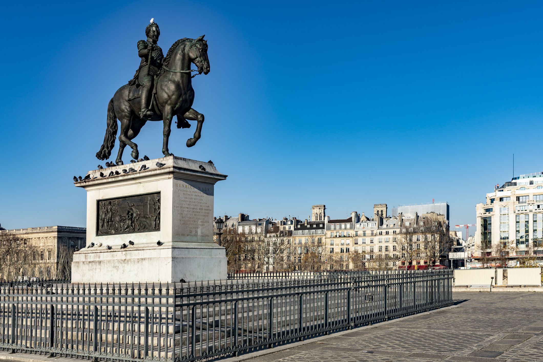 2019 The banks of the River Seine in Paris with the statue of Henrici Magni (King Henry IV) in the foreground. It was created in 1818.