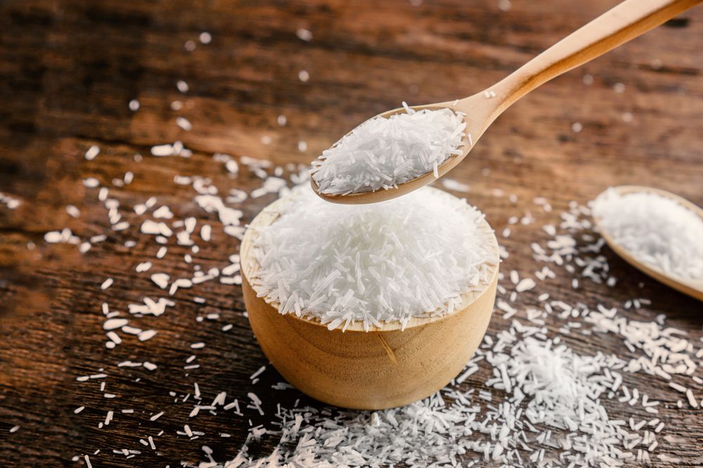 monosodium glutamate (MSG) or seasoning ,gourmet powder on wooden table