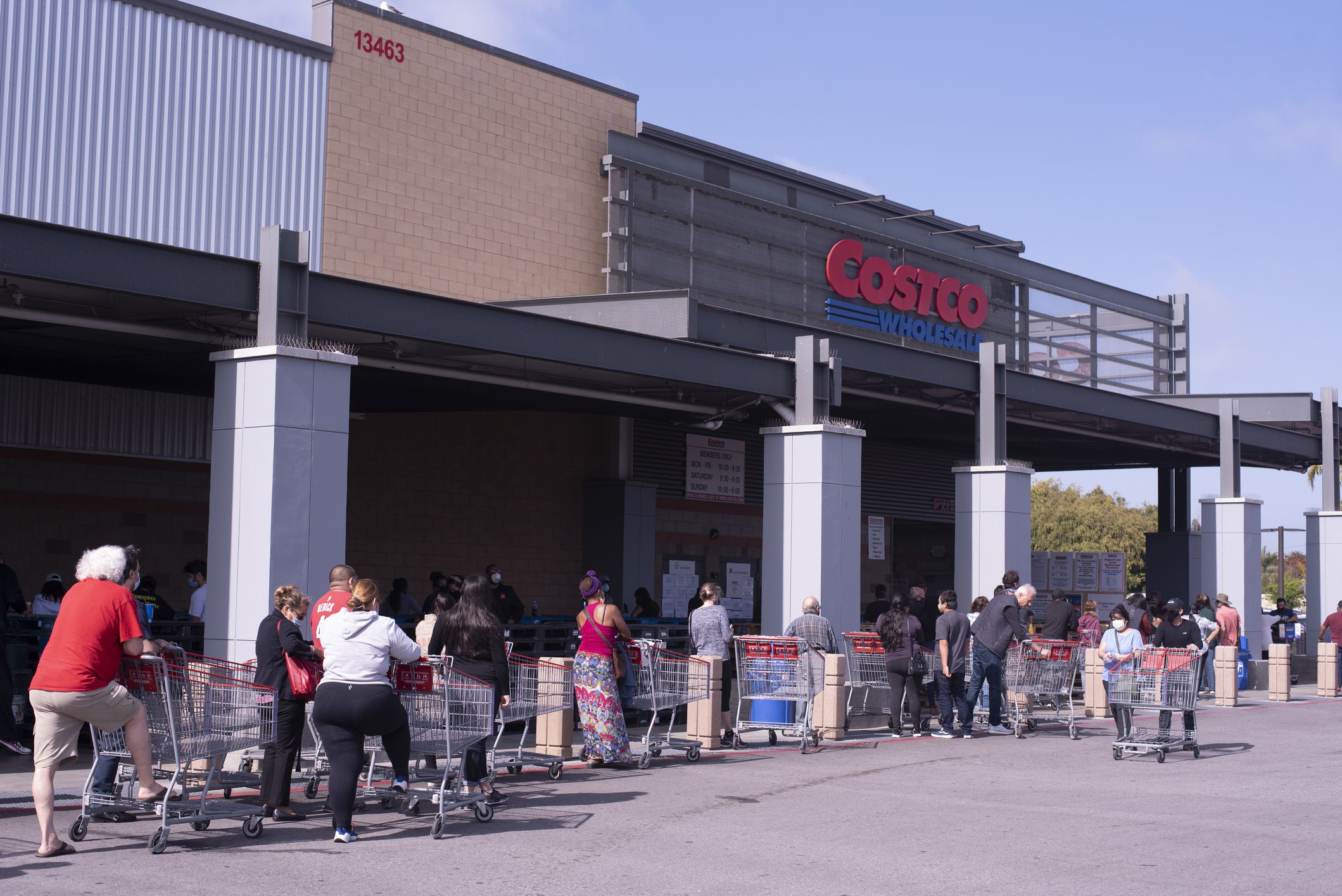 April 16, 2020 / Los Angeles, CA: People lined up at Costco wearing masks keeping six feet apart.