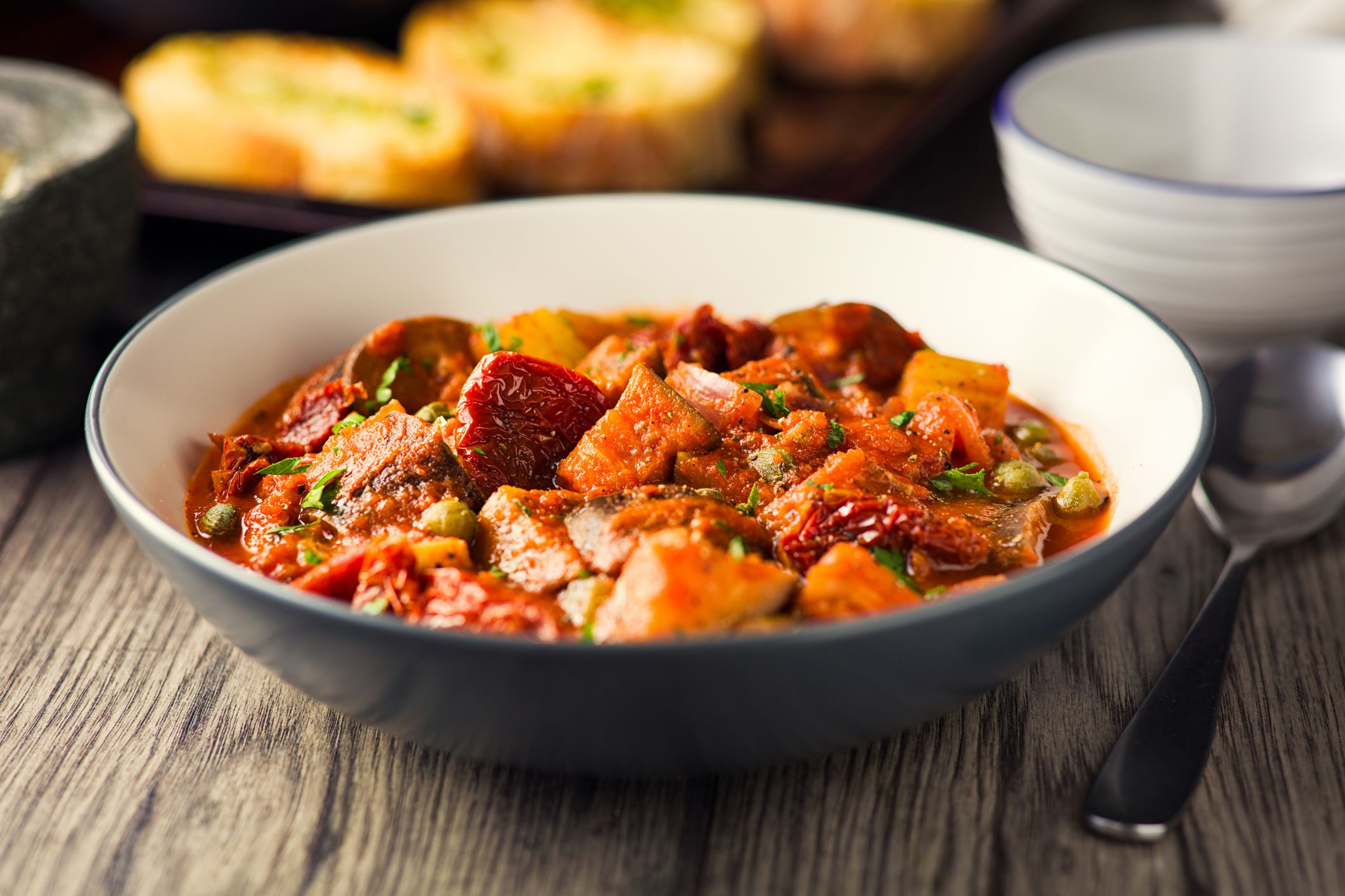 Home made freshness classic caponata service with vegan garlic bread