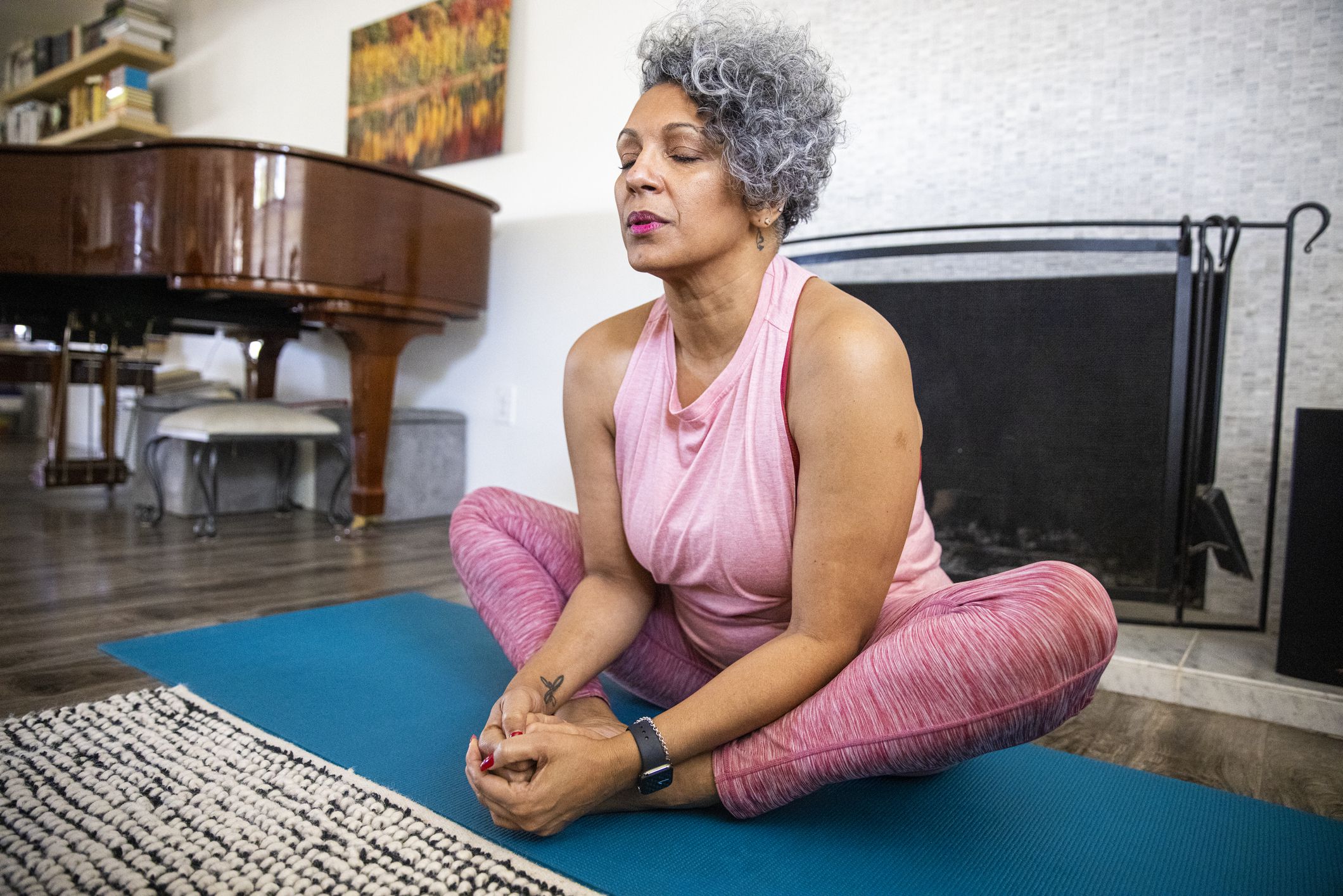 A beautiful mature black woman doing yoga.