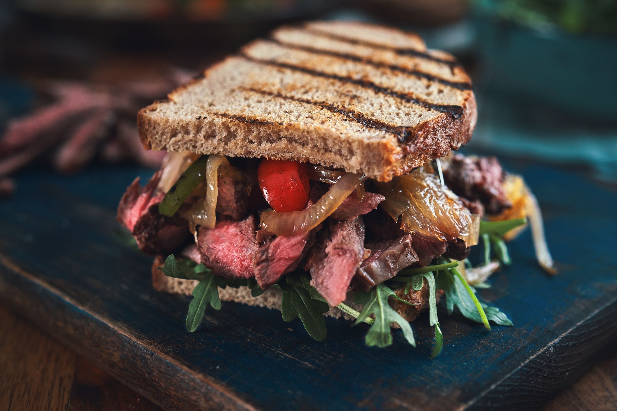 Preparing Steak Sandwich with Roasted Bell Pepper and Arugula