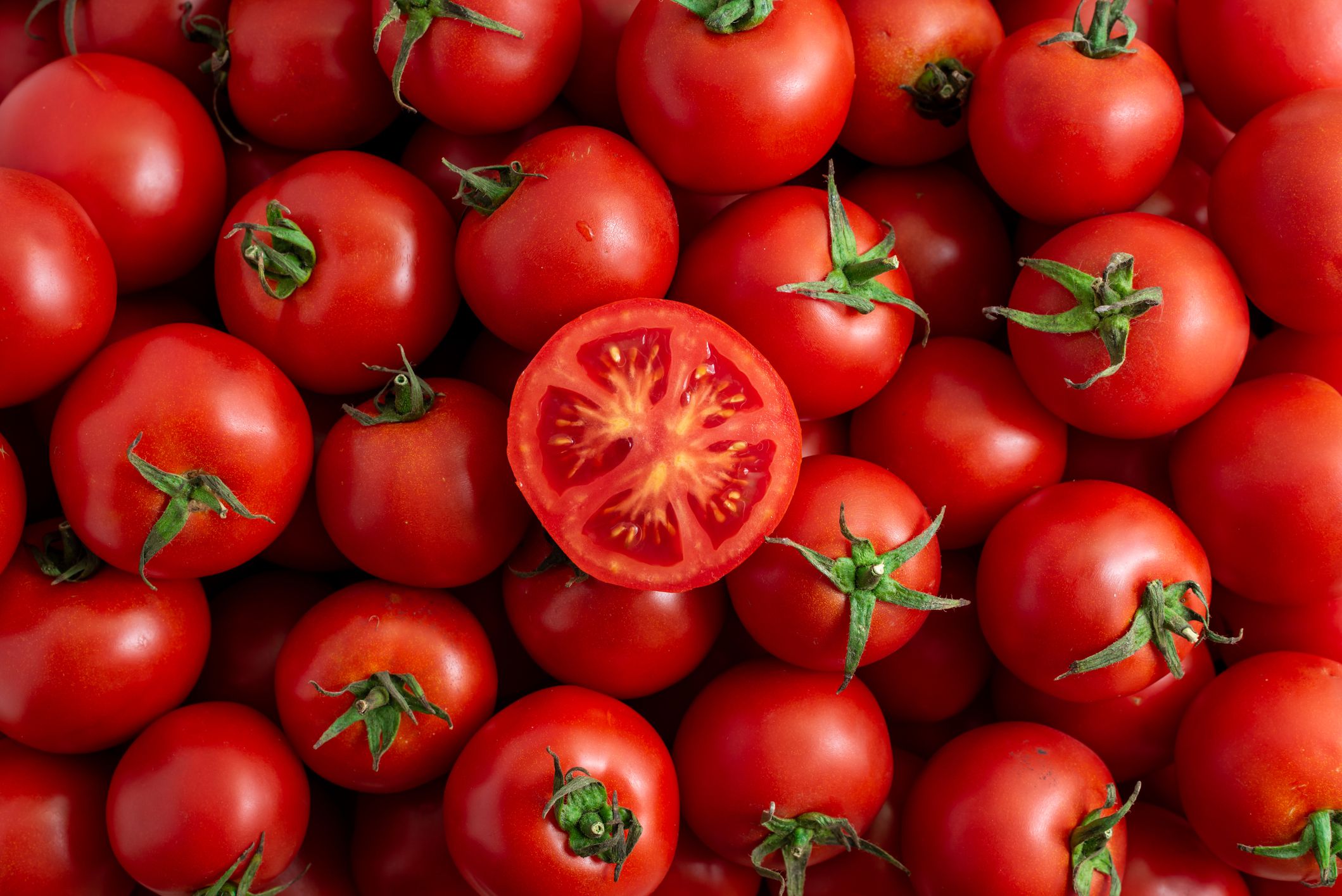 cut red tomato close-up in a box in the market