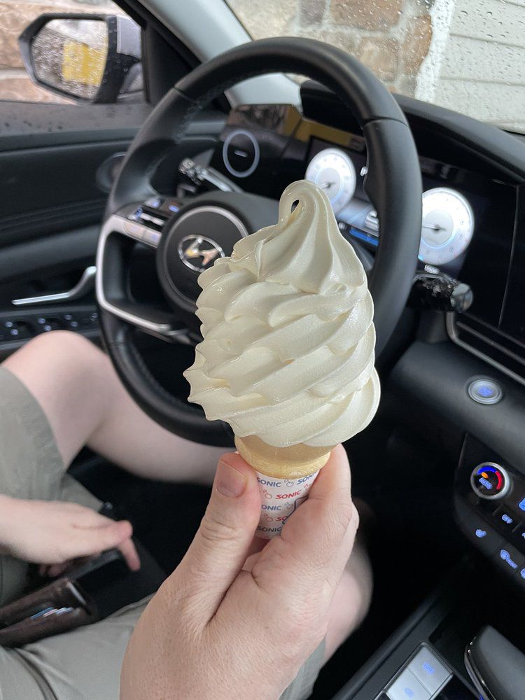 a cone of vanilla soft serve from sonic drive-in