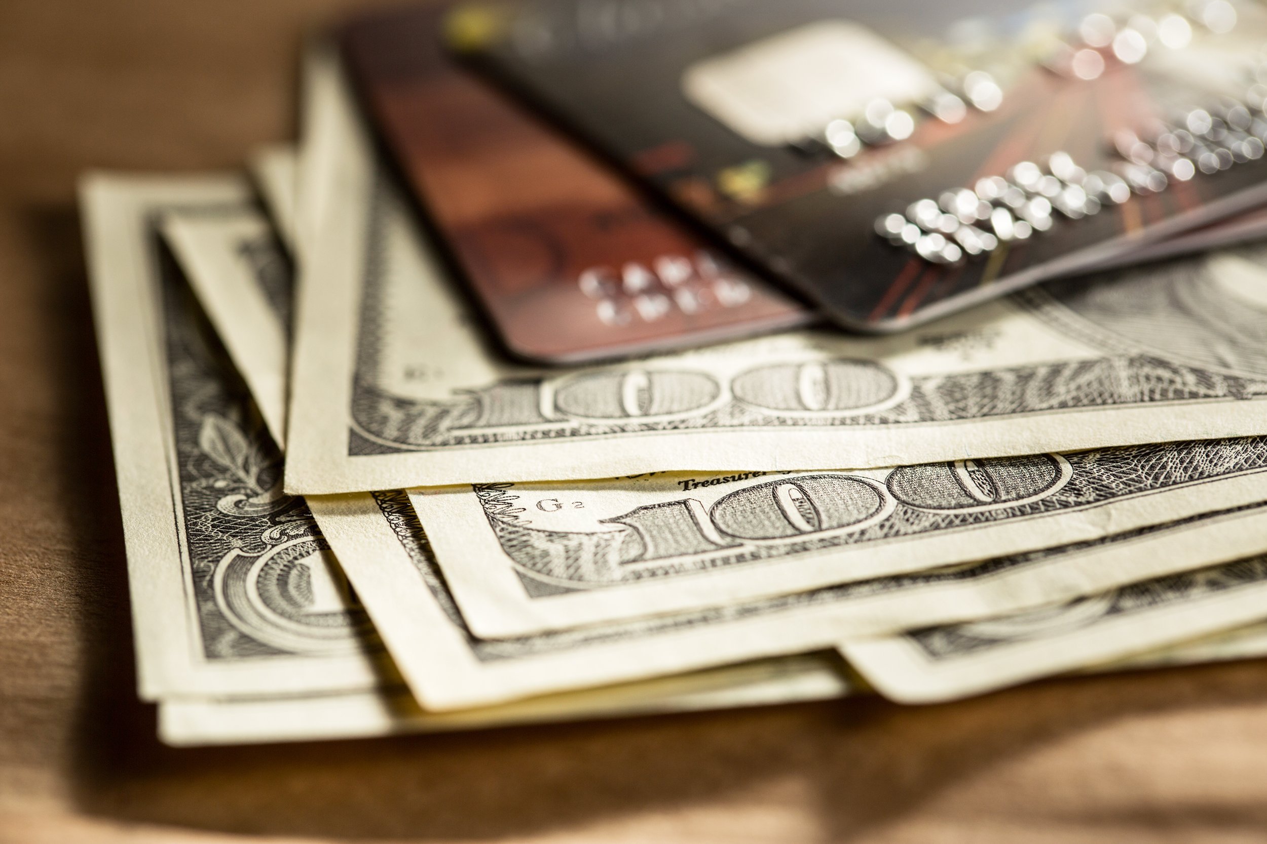 credit cards and dollars in cash