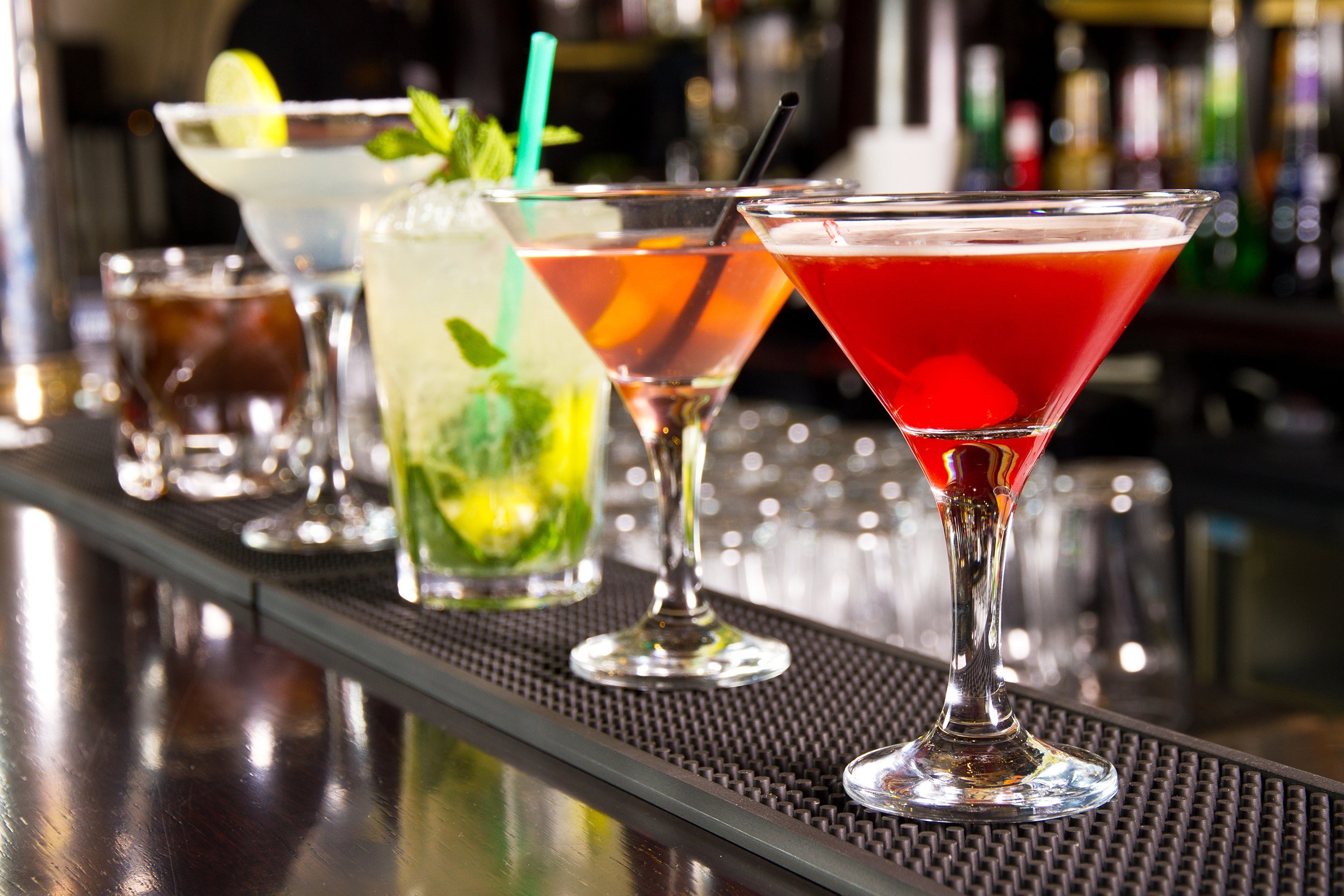 five cocktails on the bar counter