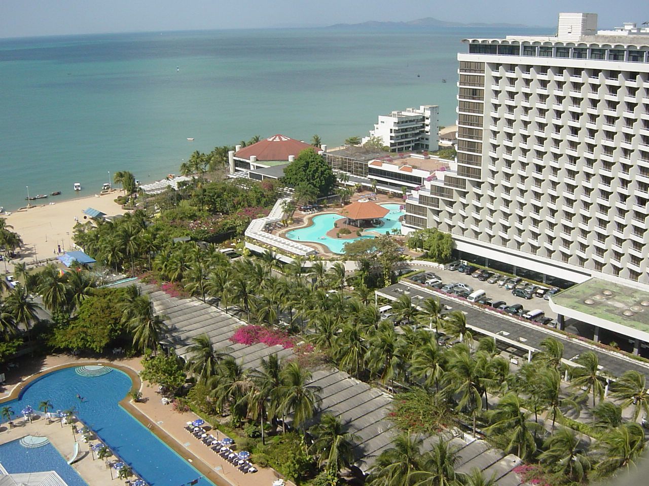 Daytime view of Ambassador City Jomtien with ocean in background.