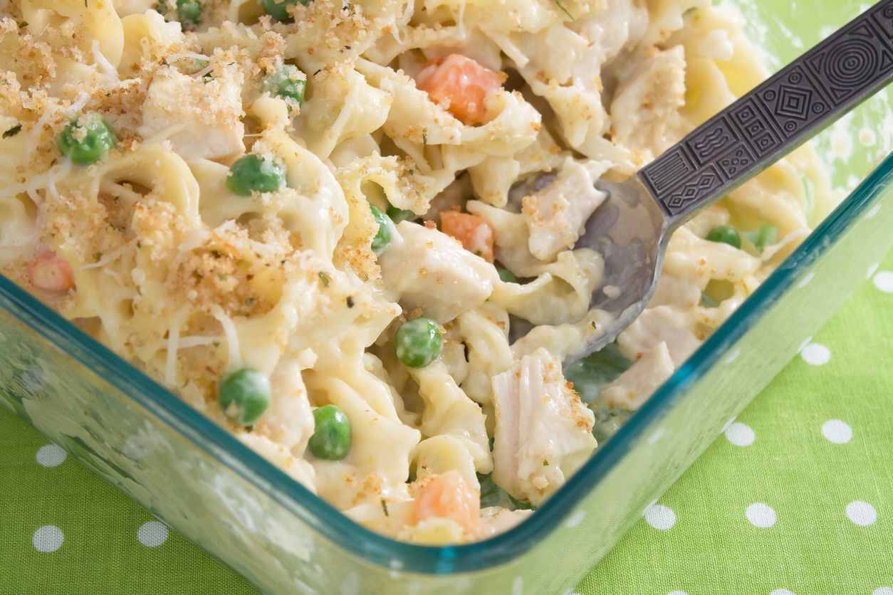Baked Chicken Noodle Casserole in a clear glass baking dish