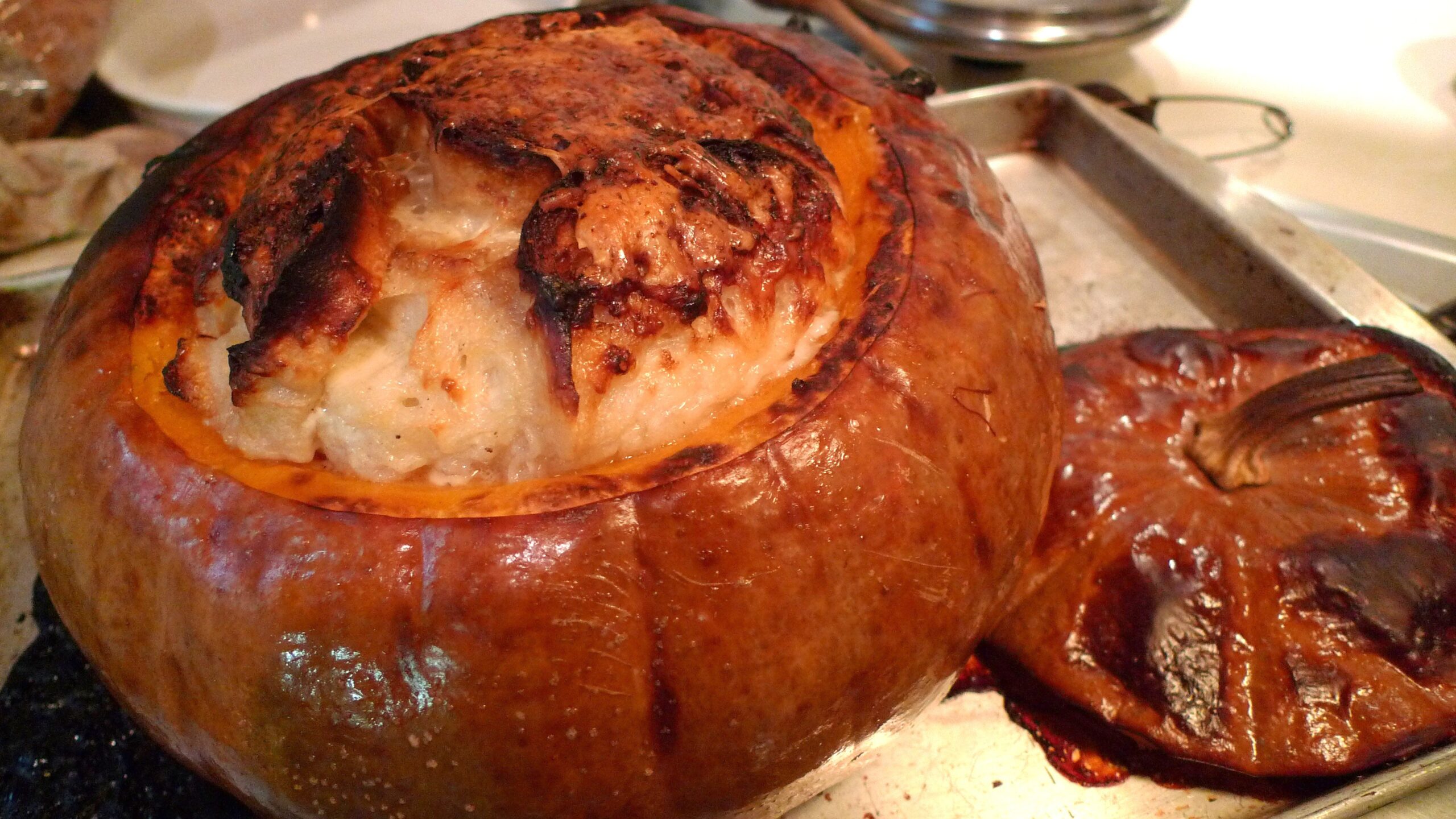 Whole baked pumpkin filled with souffle.