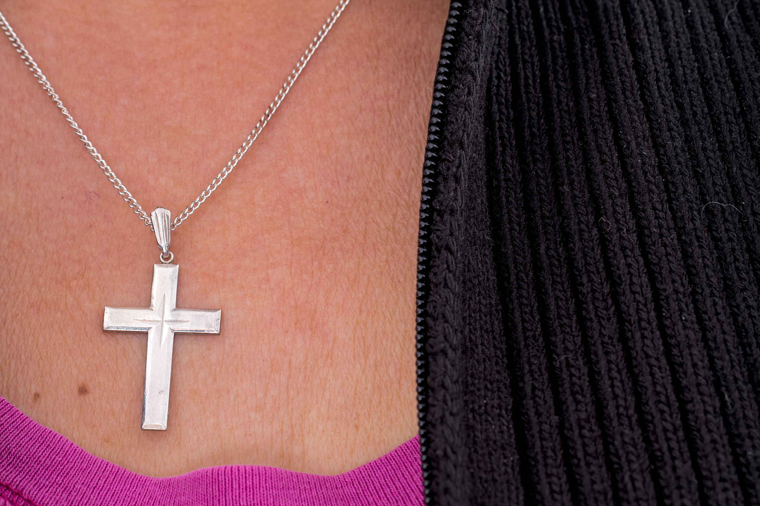 Cross necklace on a woman