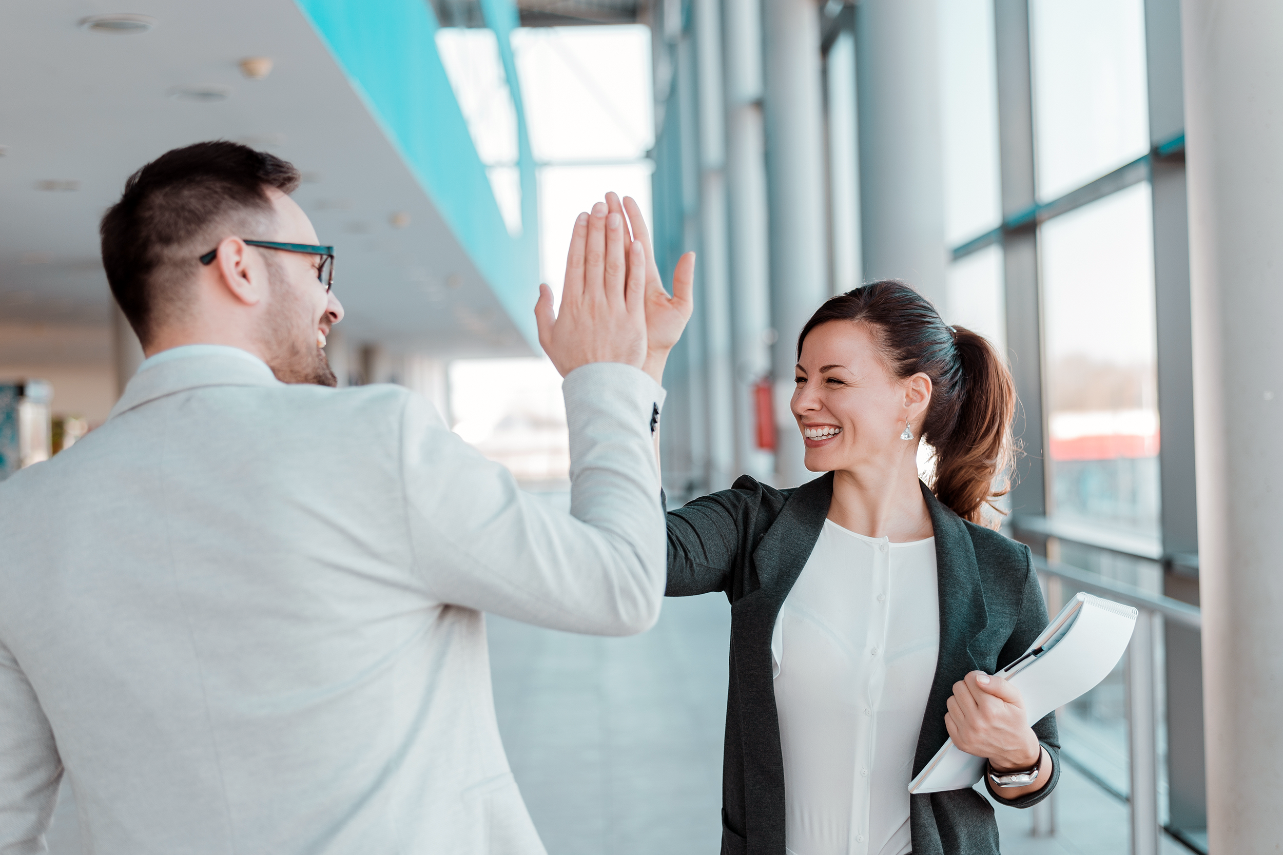 Coworkers giving each other a high-five
