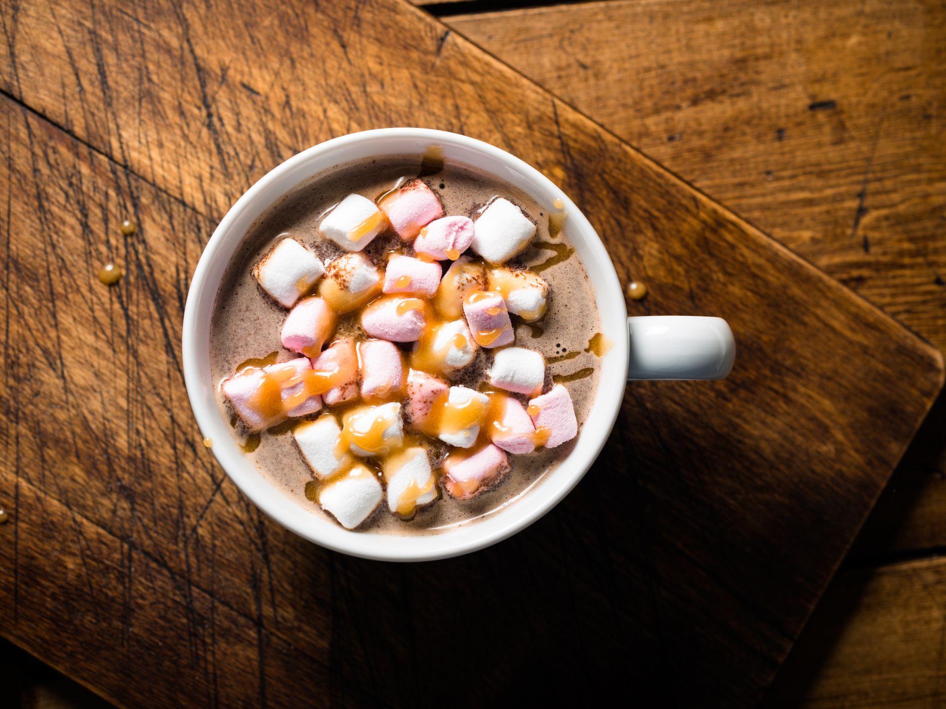 Hot Chocolate topped with marshmallows and salted caramel sauce.