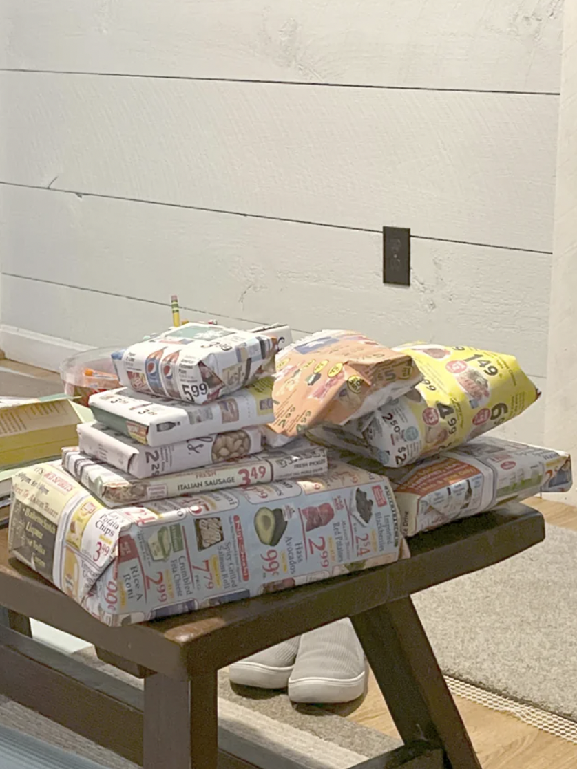 Reddit screenshot of someone who wrapped gifts with old news flyers.