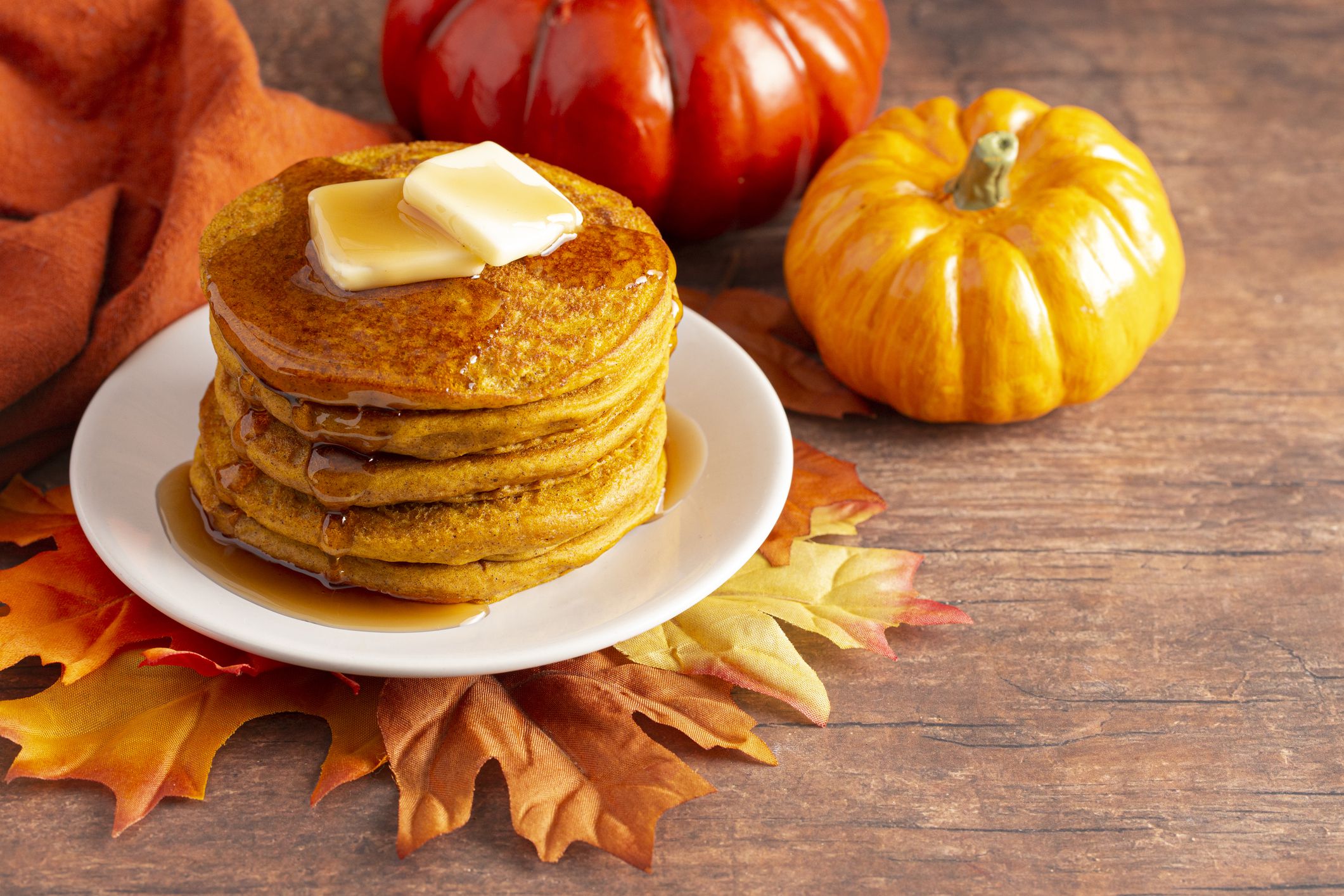 A Stack of Pumpkin Spice Flavored Pancakes on a Wooden Table