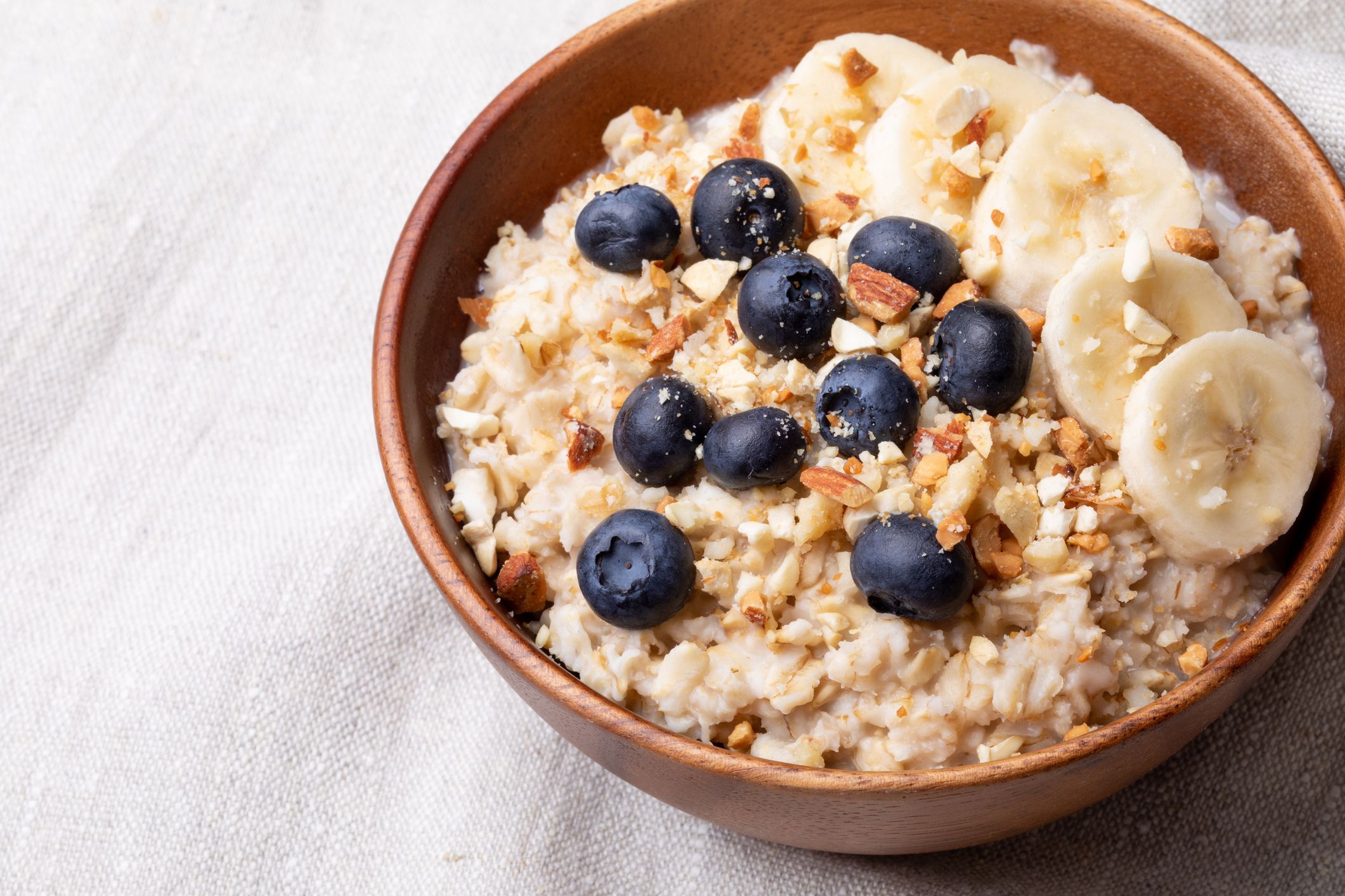 oatmeal with bananas, blueberries and almonds.Vegan food.