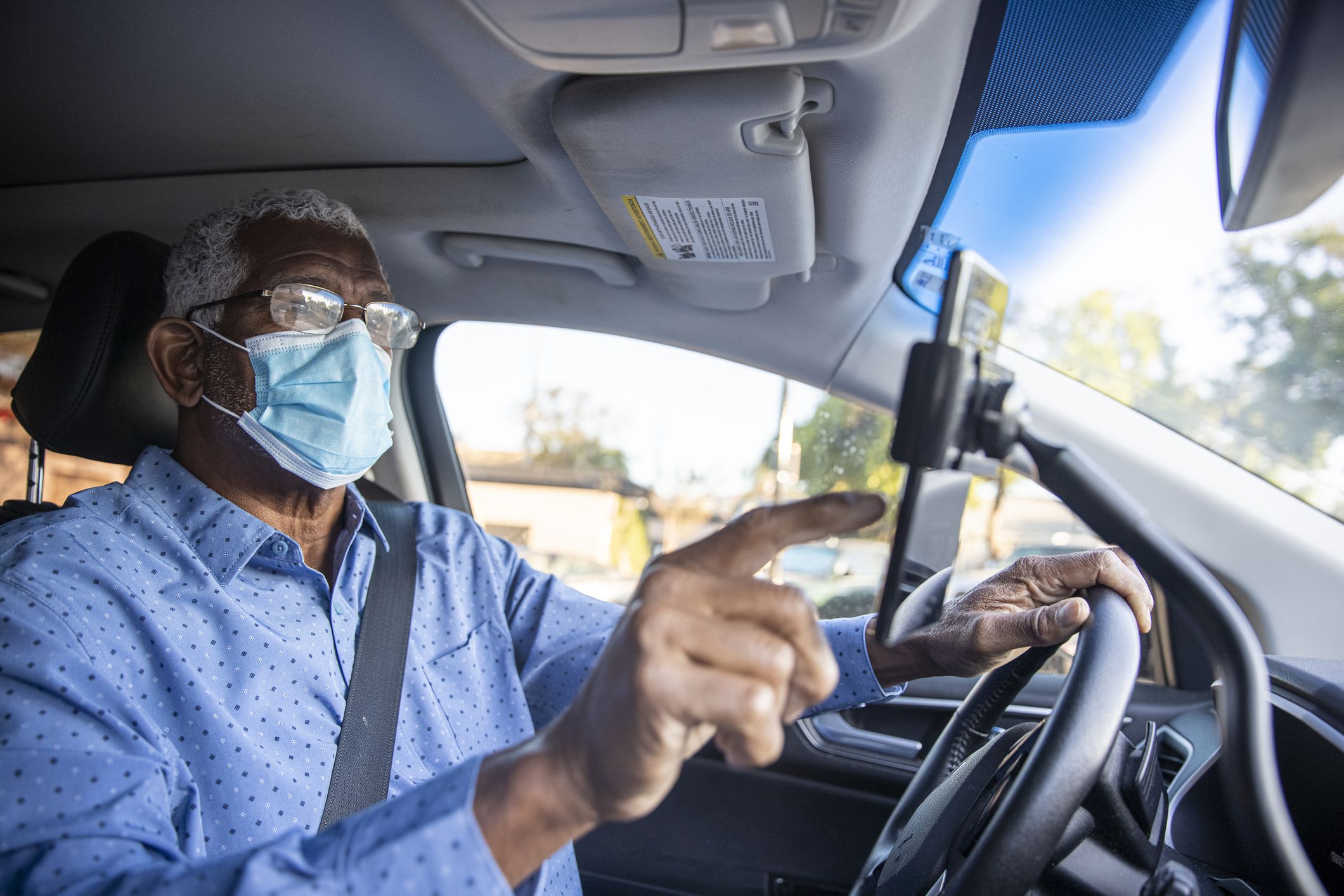 Senior Black rideshare driver