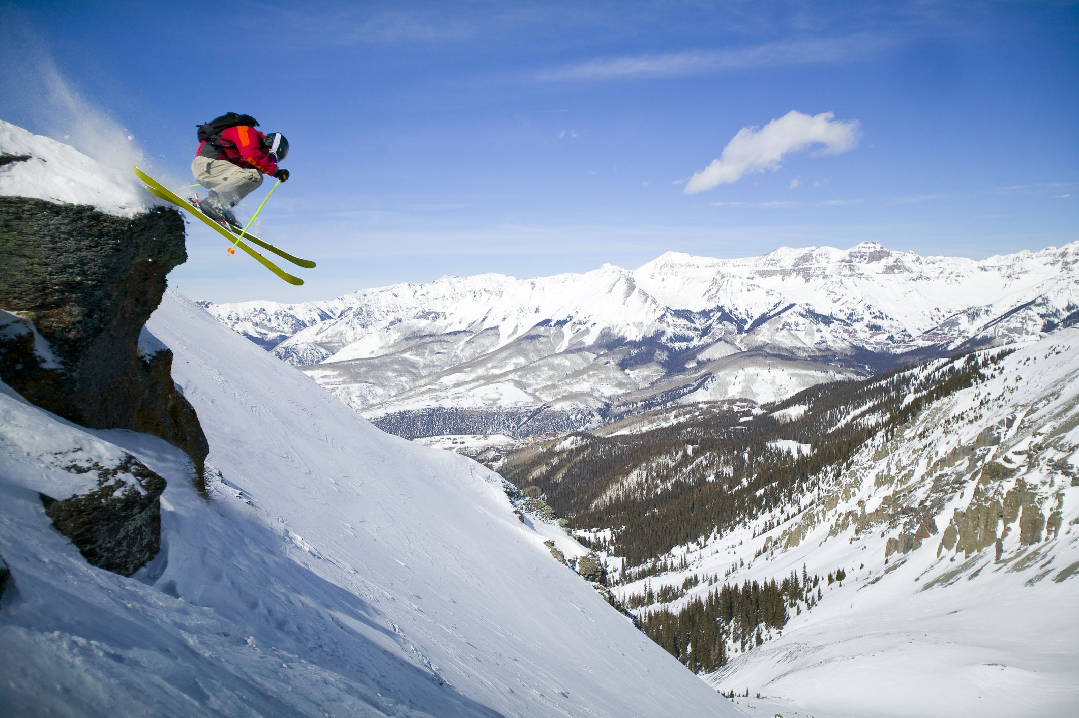 skier jumping off cliff