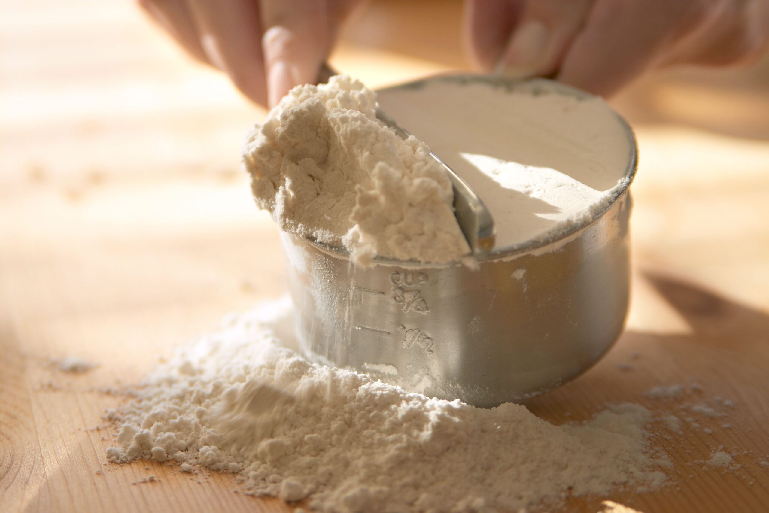 Baking - measuring flour.