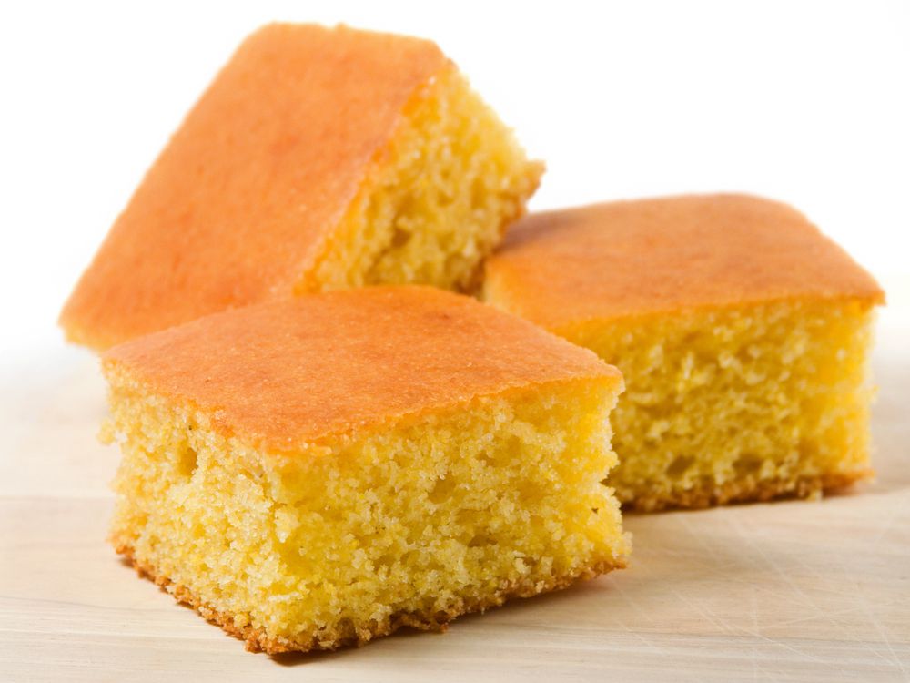Three pieces of cornbread on white