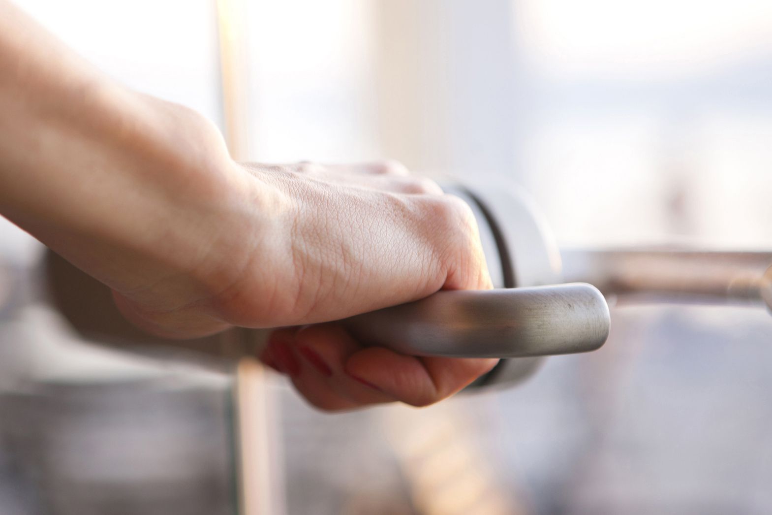 hand on door handle, close up