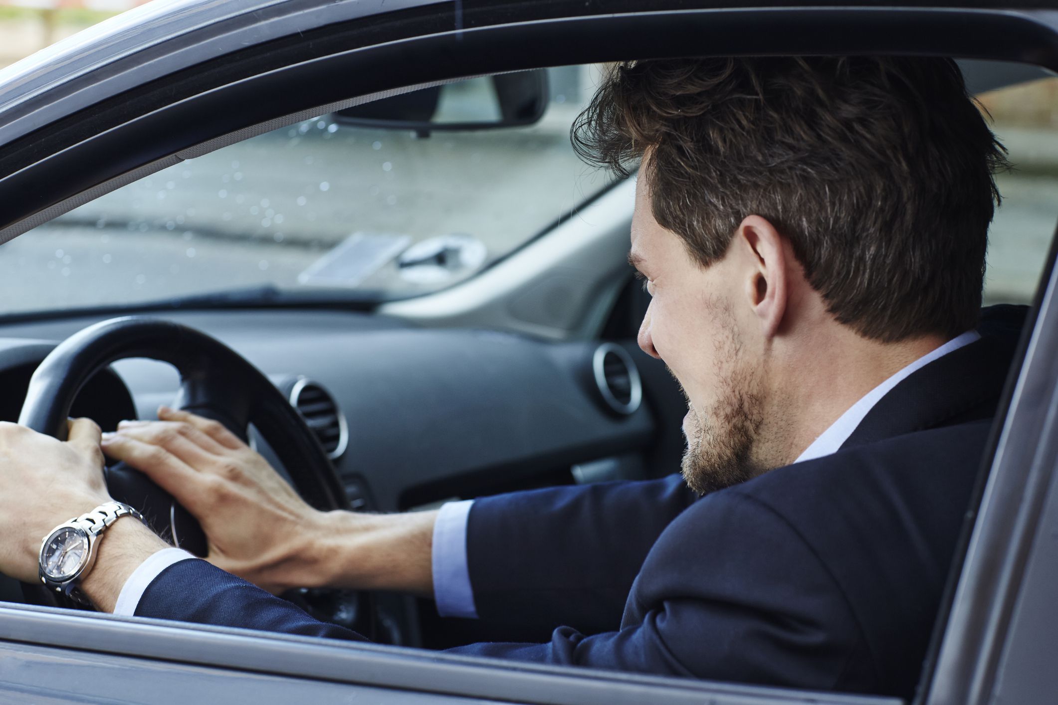 angry driver slamming fist on car horn