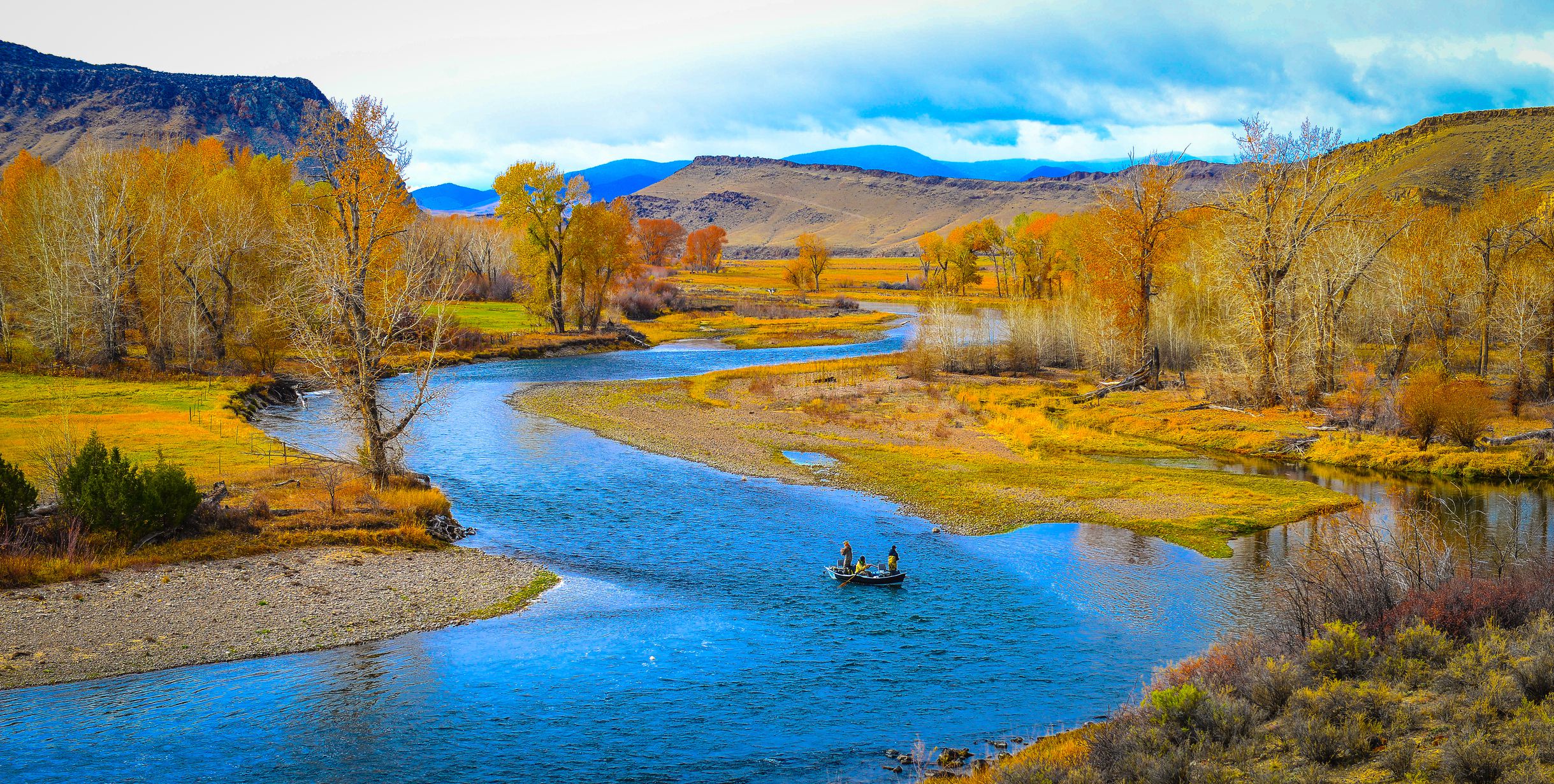 River landscape with a drift fishing boat