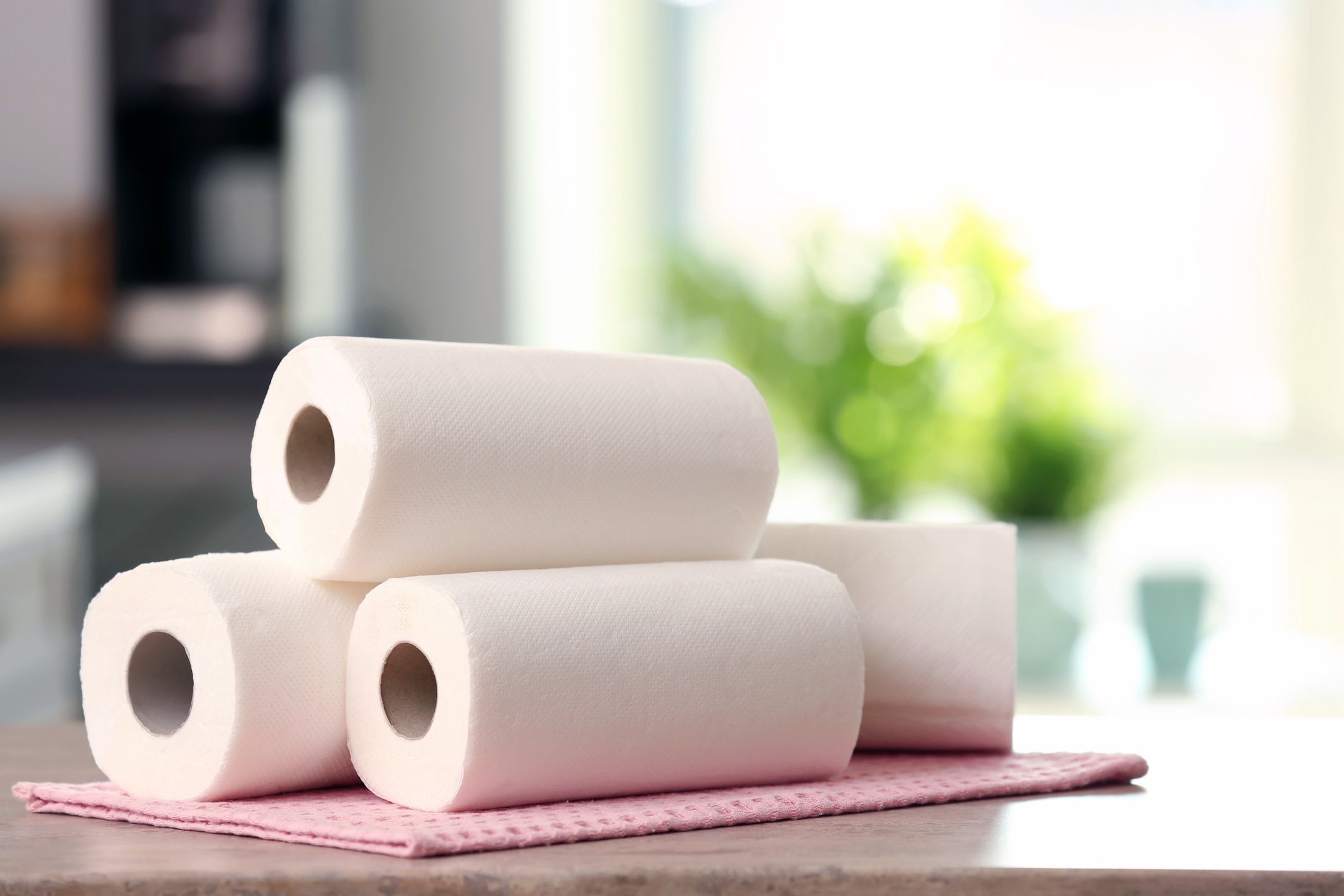 four paper towel rolls on counter