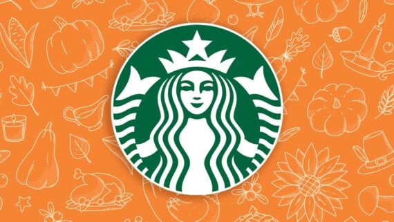 The Starbucks logo, a green and white siren, is centered on an orange background decorated with white autumn-themed line drawings like pumpkins, leaves, a sunflower, a pie, a turkey, and a candle.