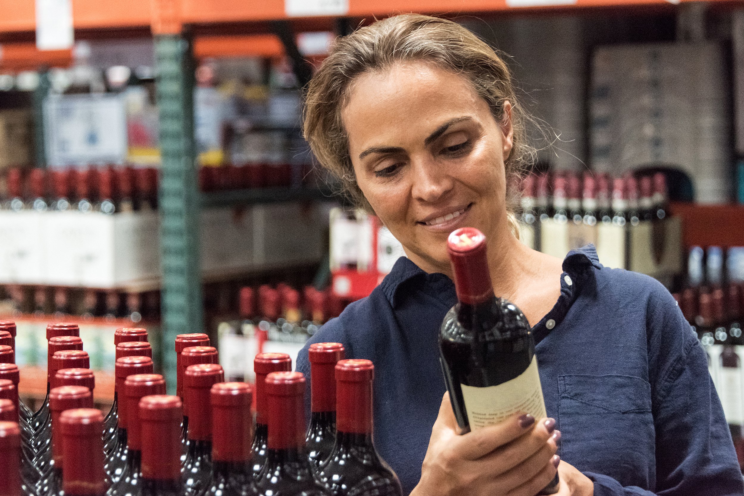 woman shopping for wine in winery store