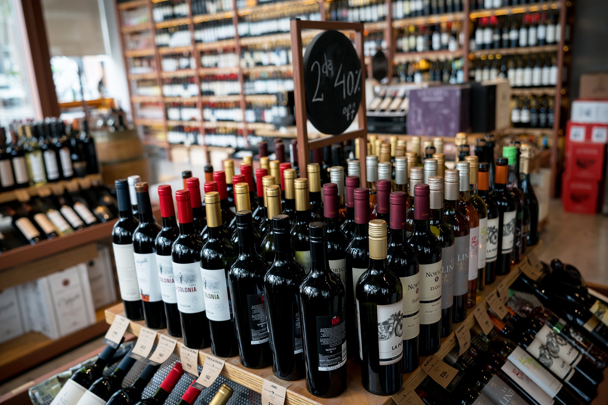 close up of wine bottles on sale at a winery